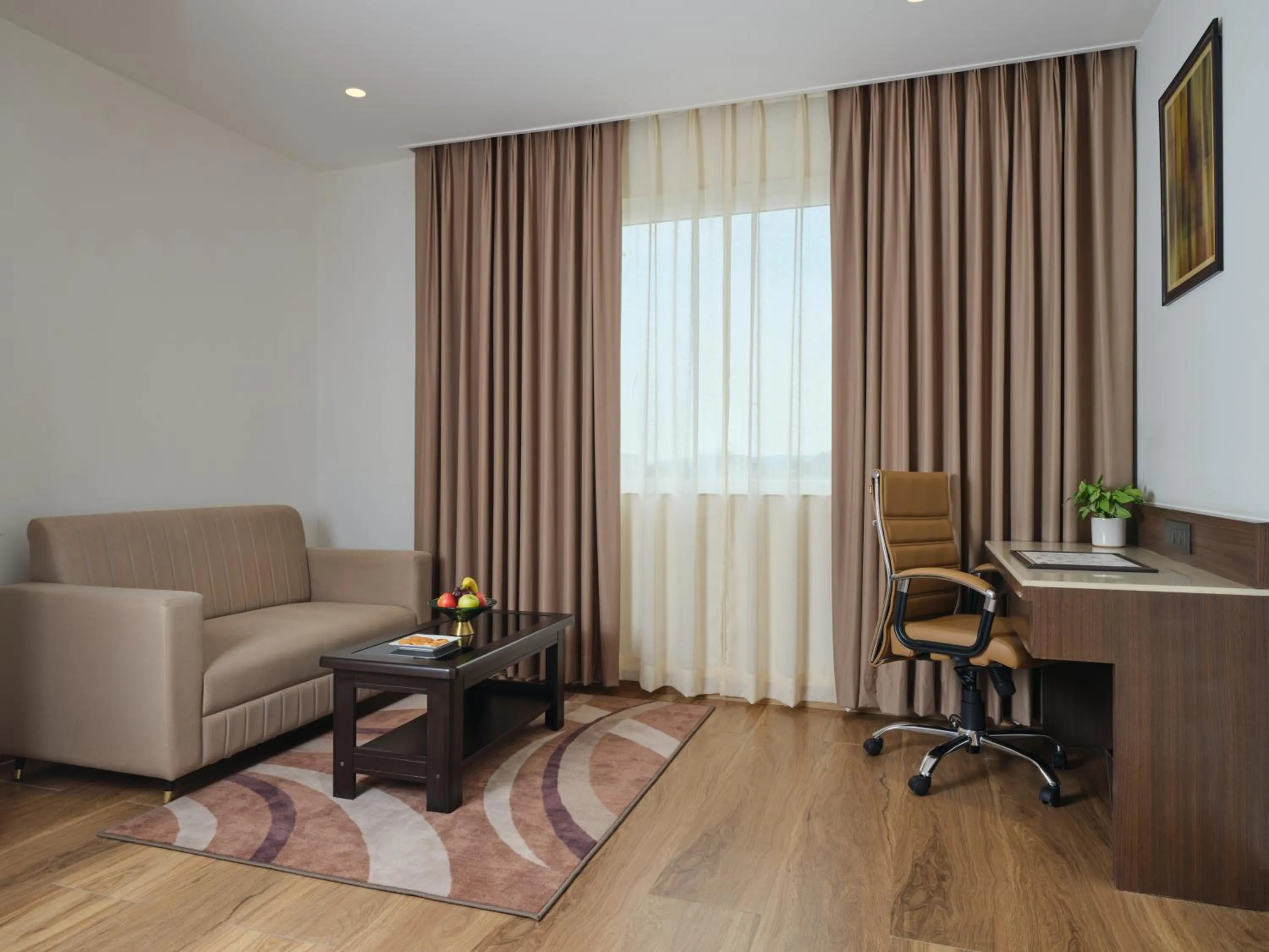 Communal lounge/ TV room in Regenta Place Gwalior