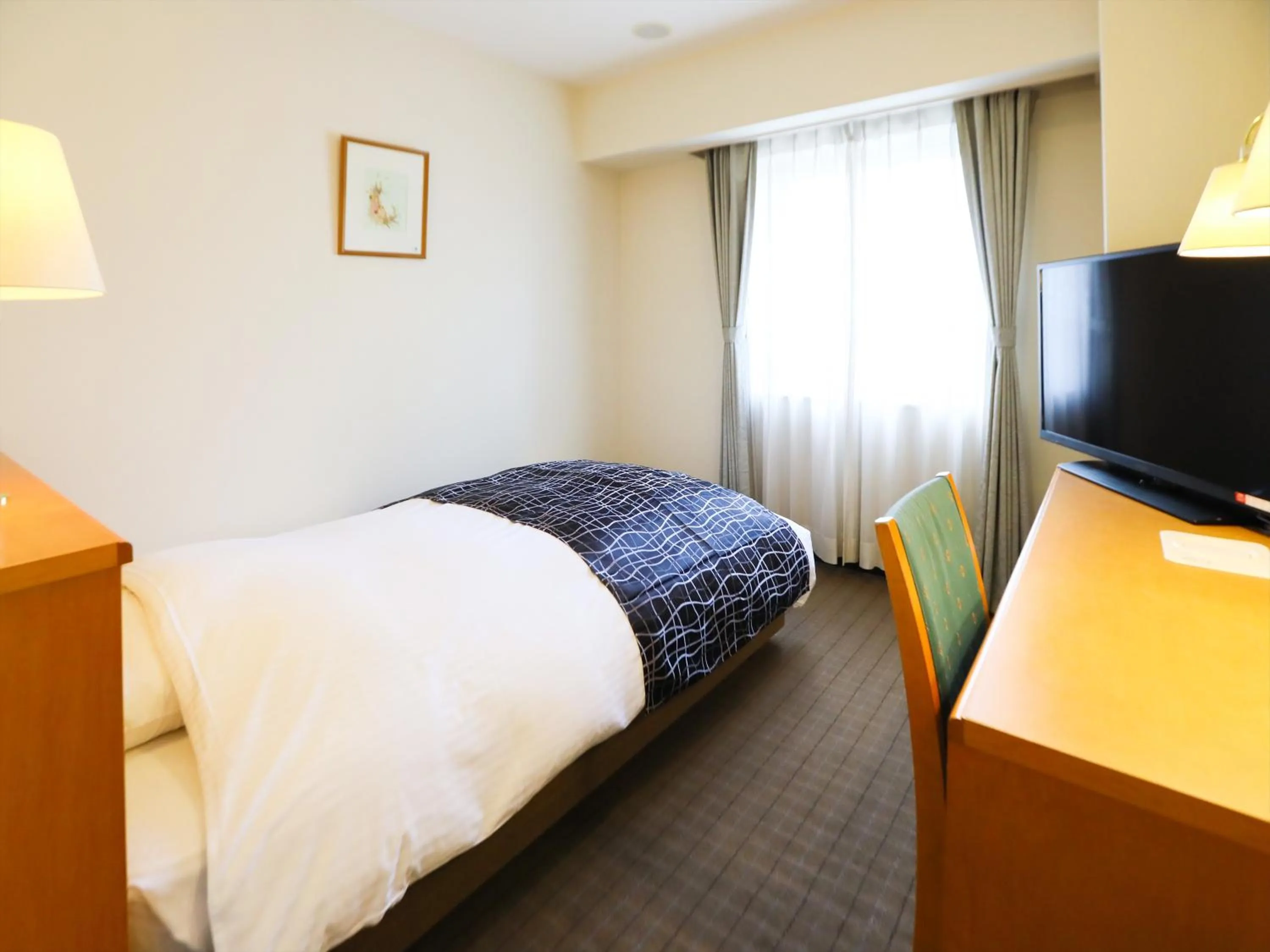 Photo of the whole room, Bed in APA Hotel Obihiro Ekimae