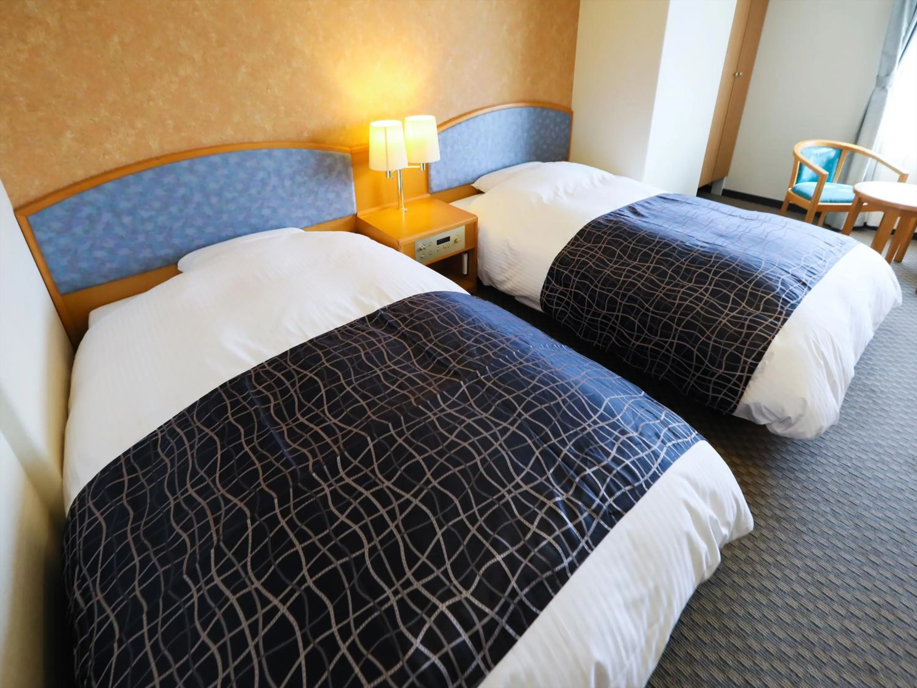 Photo of the whole room, Bed in APA Hotel Obihiro Ekimae
