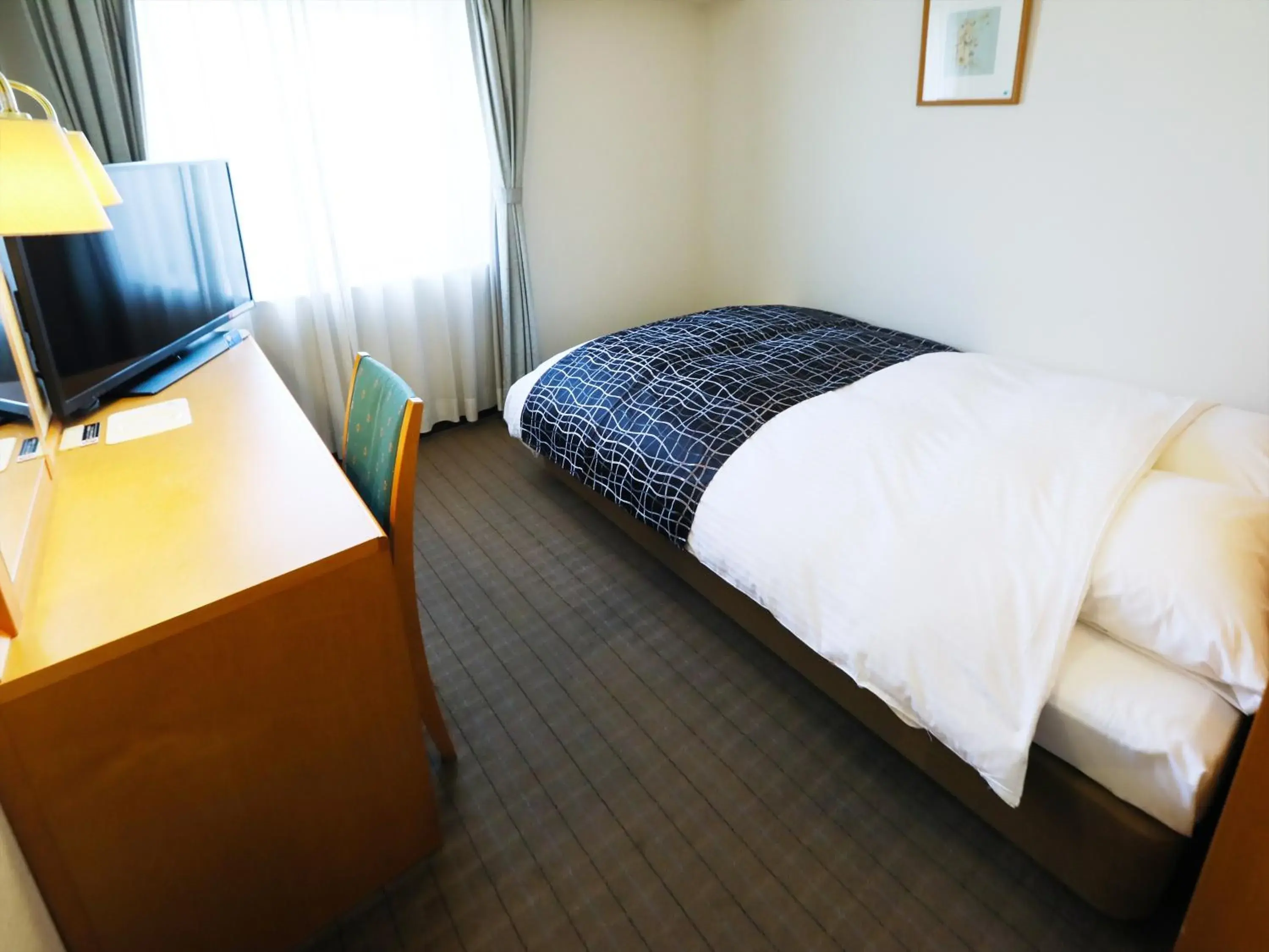 Photo of the whole room, Bed in APA Hotel Obihiro Ekimae Photo of the whole room, Bed in APA Hotel Obihiro Ekimae