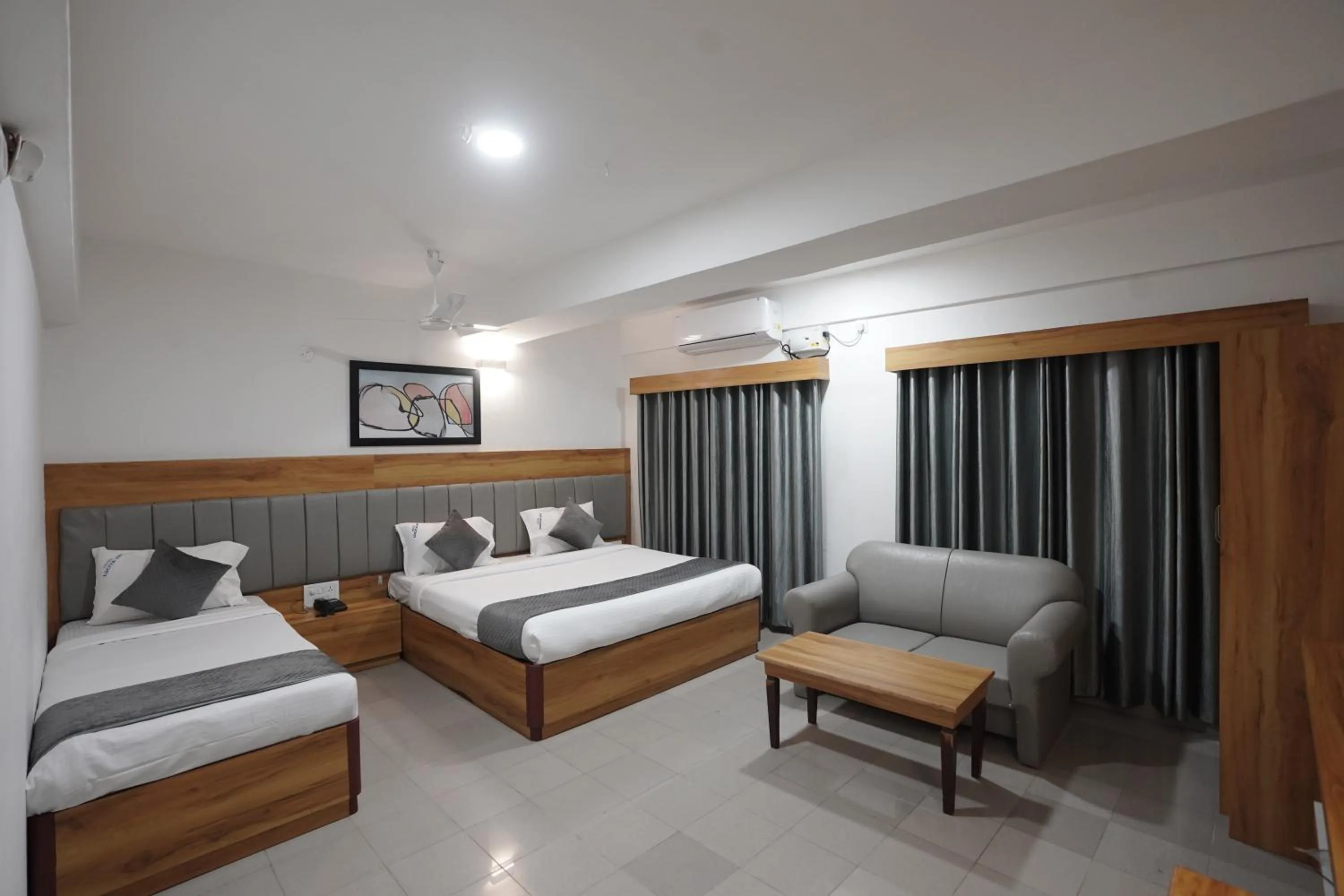 Bed in Luciya International Mysore