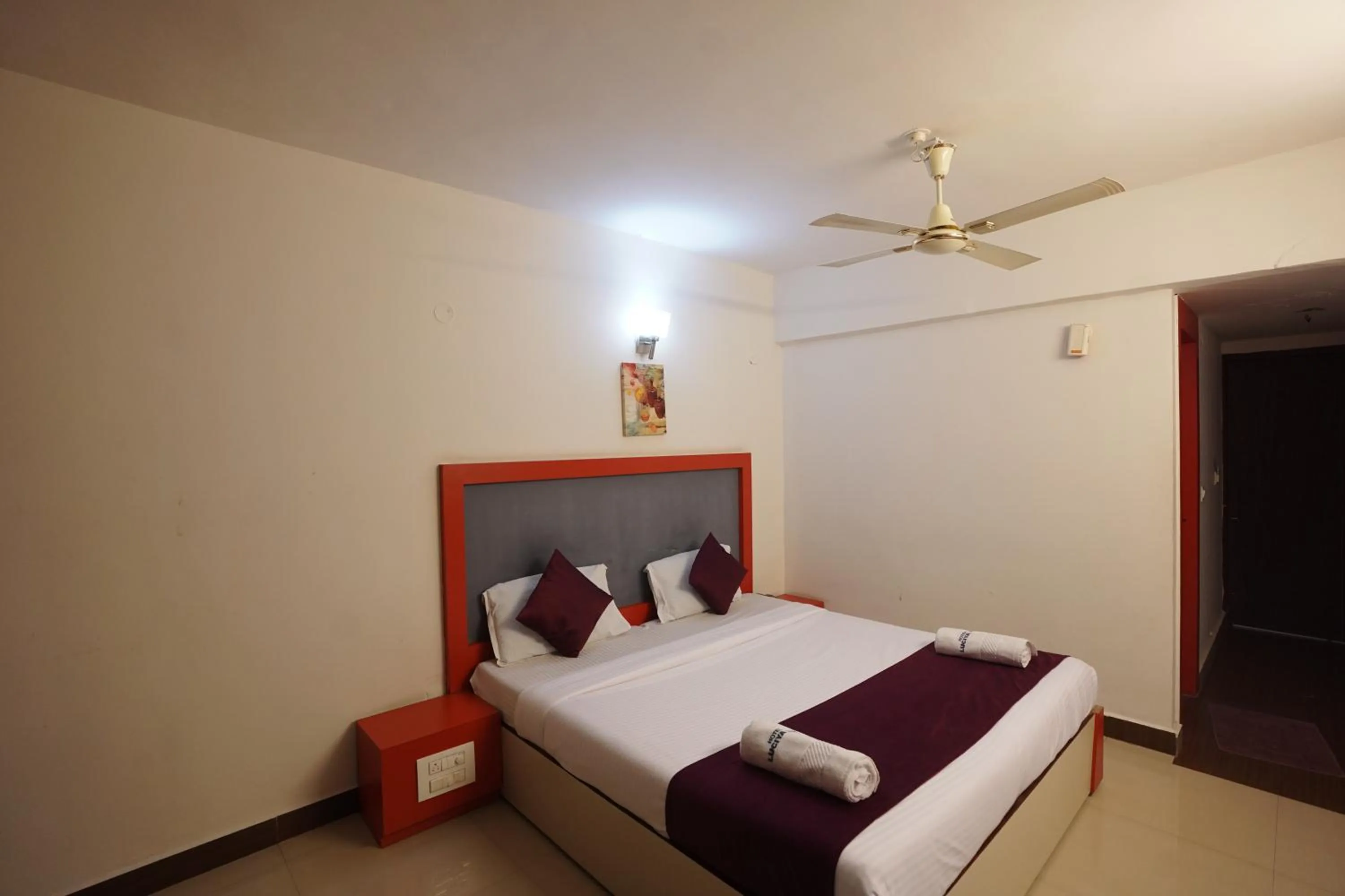 Bedroom in Luciya International Mysore