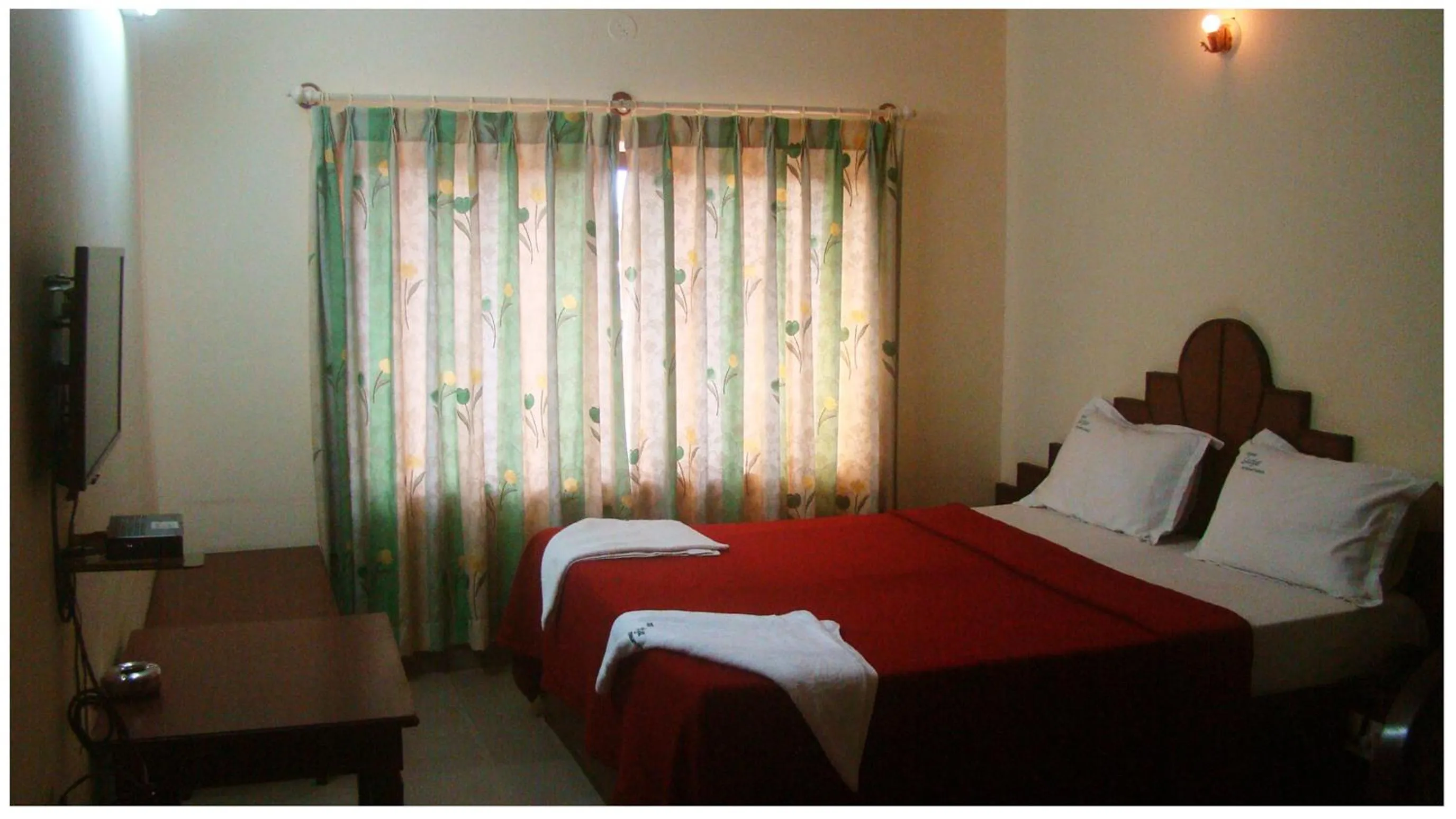 Bed in Luciya International Mysore