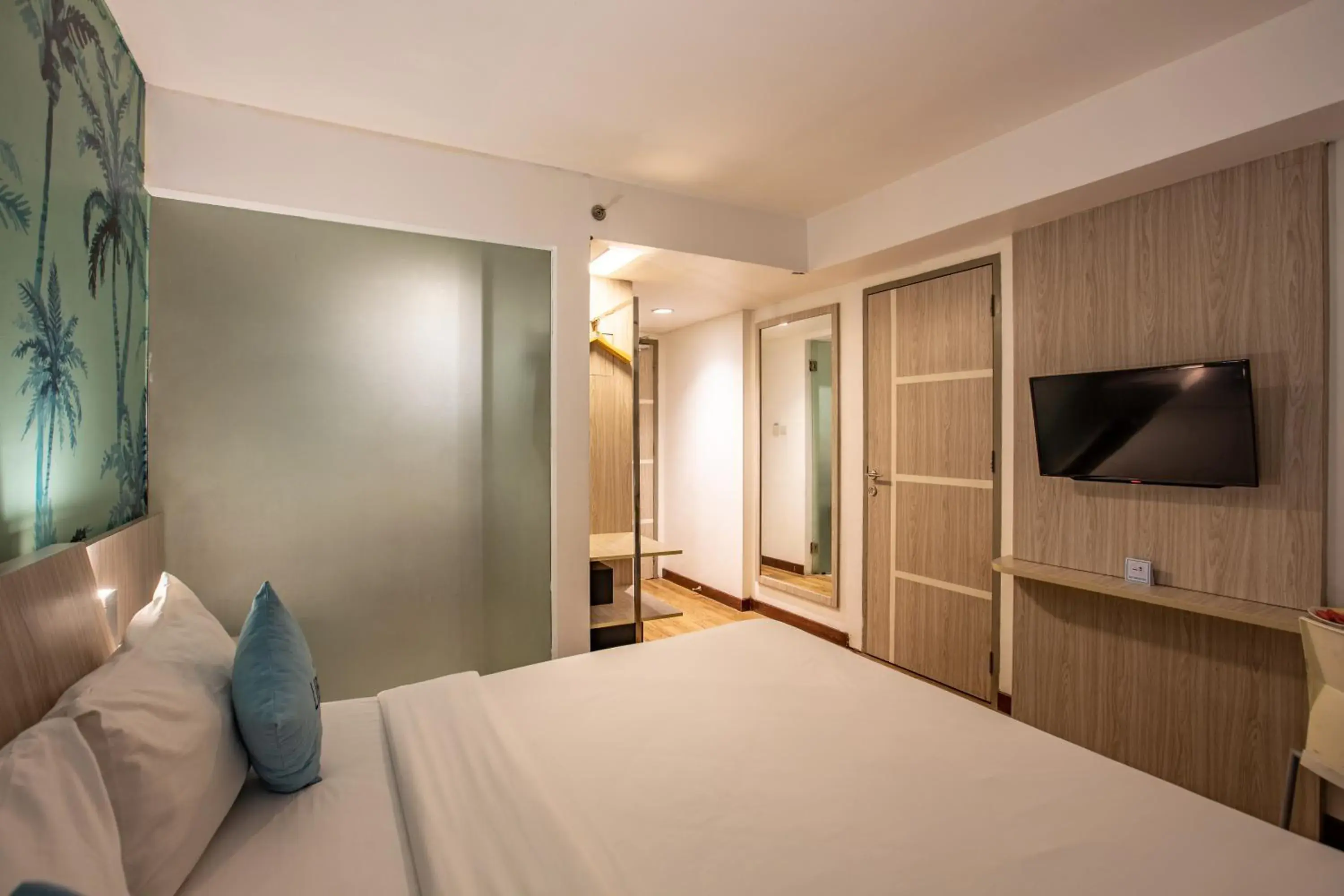 TV and multimedia, Bed in Liberta Seminyak Hotel TV and multimedia, Bed in Liberta Seminyak Hotel