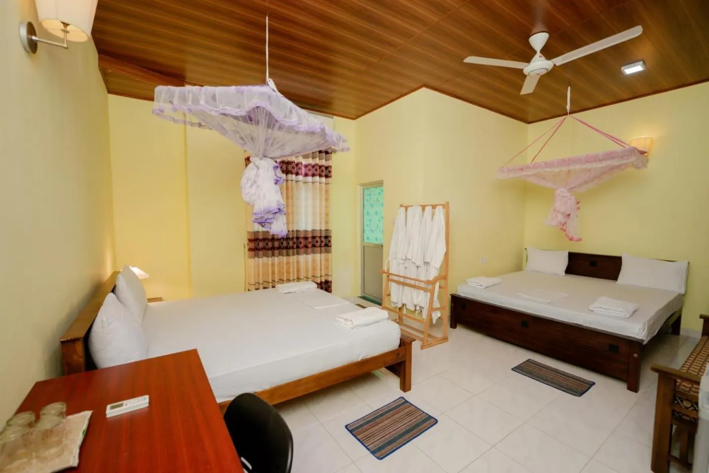 Bed in Suwani Pinnawala Homestay
