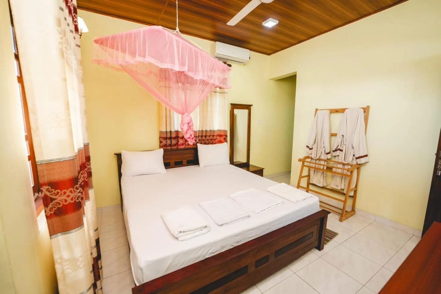Bed in Suwani Pinnawala Homestay