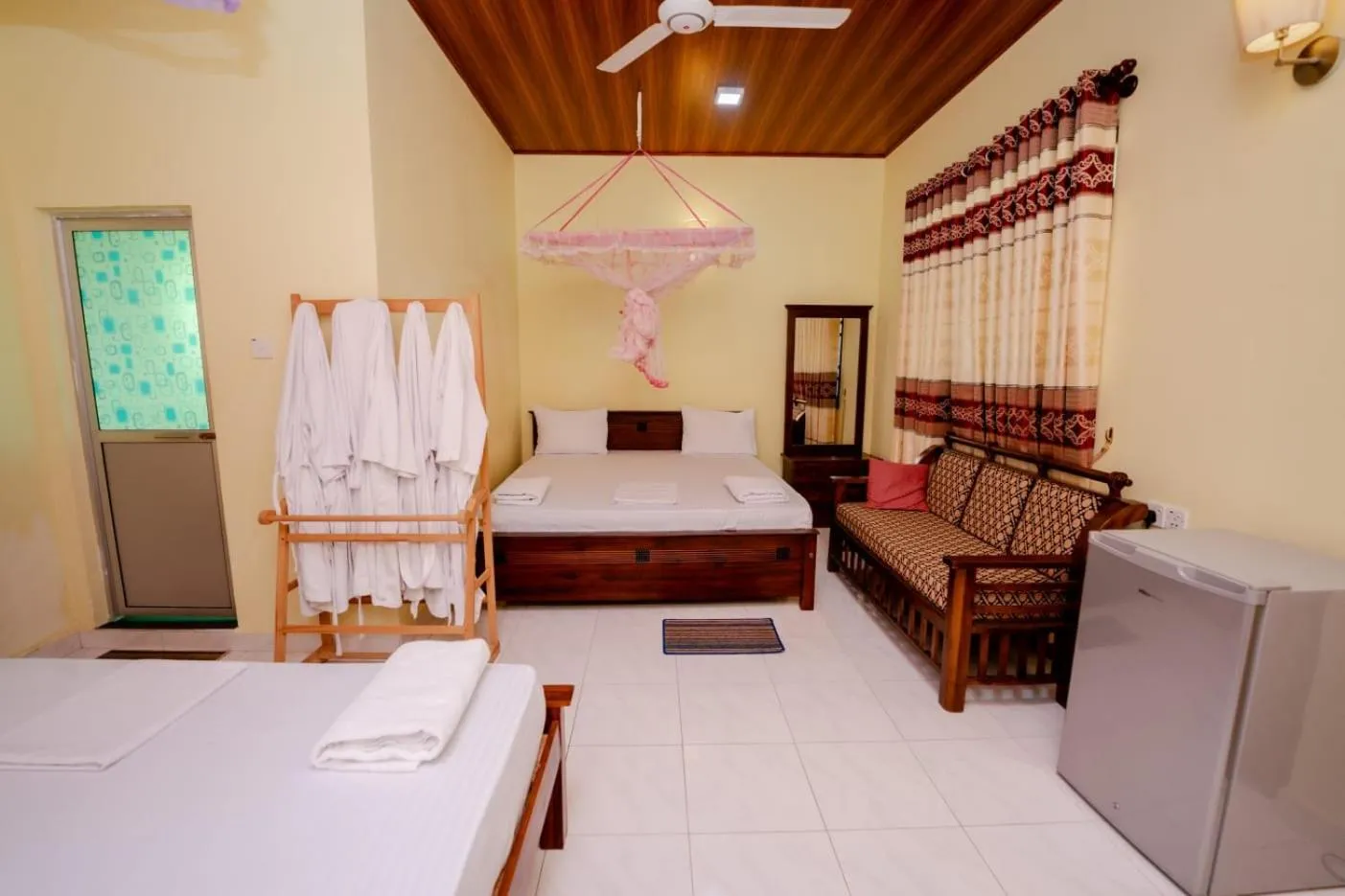 Bed in Suwani Pinnawala Homestay