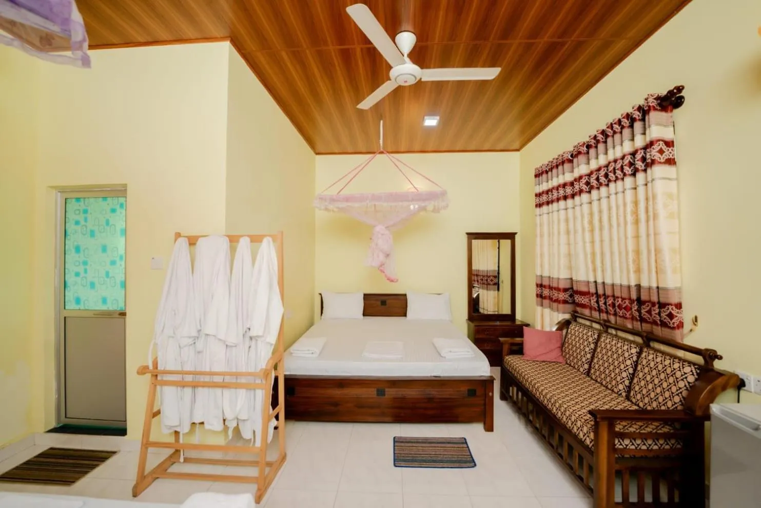 Bed in Suwani Pinnawala Homestay
