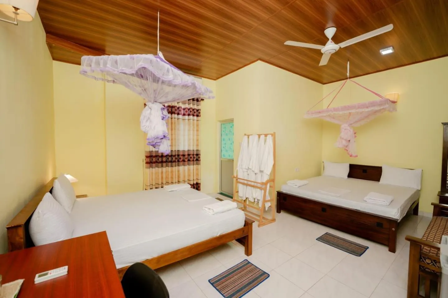 Bed in Suwani Pinnawala Homestay
