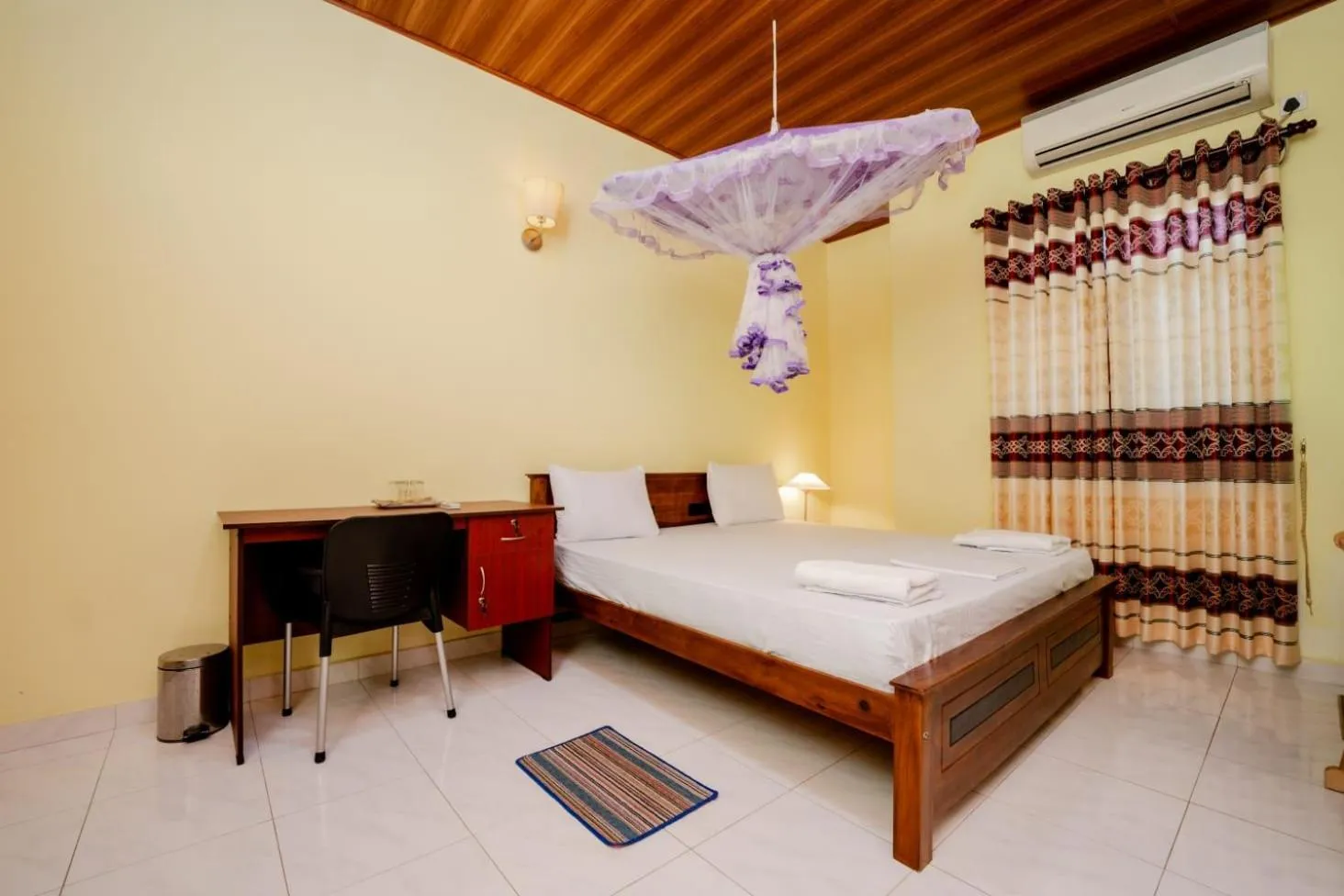 Bed in Suwani Pinnawala Homestay