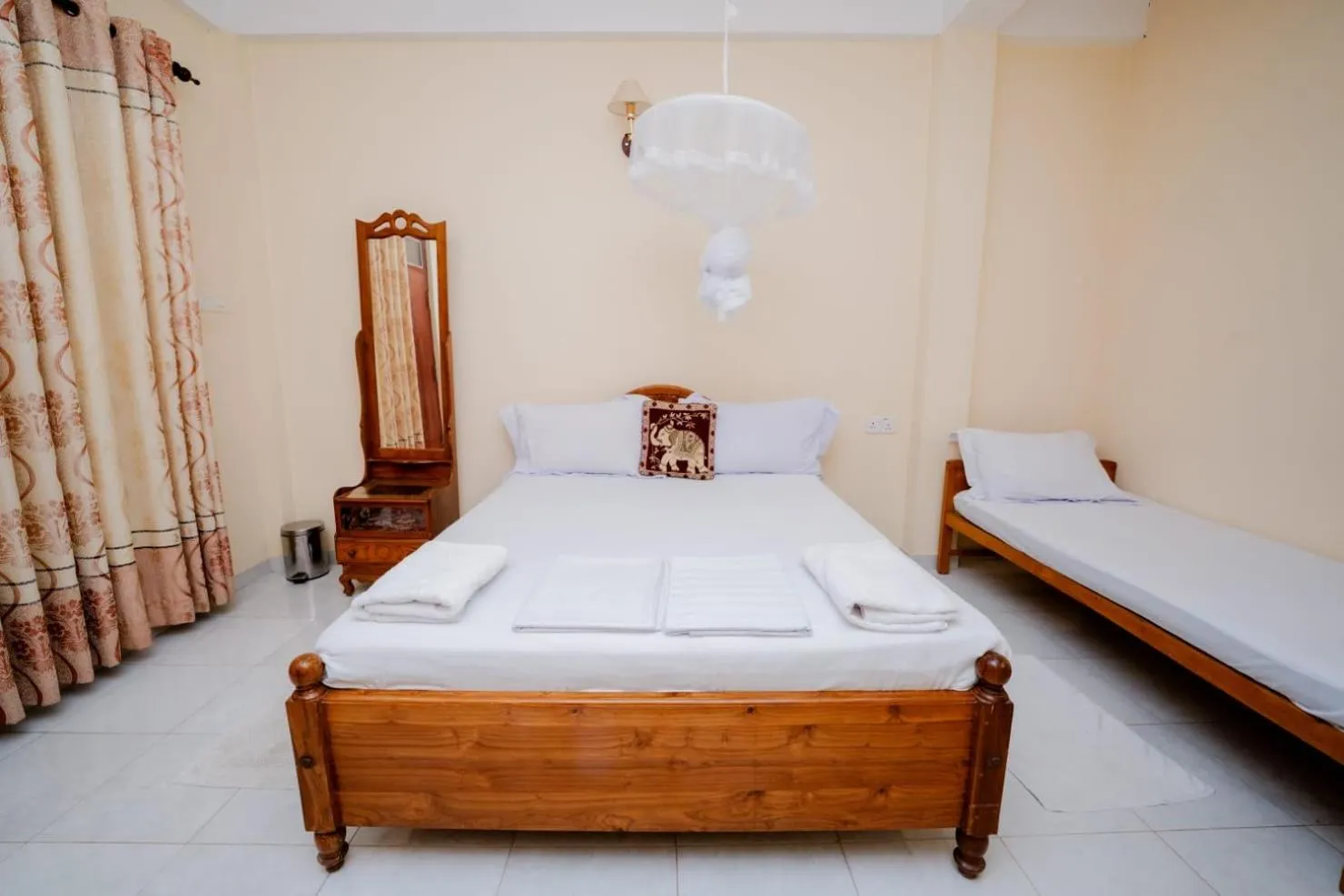 Bed in Suwani Pinnawala Homestay