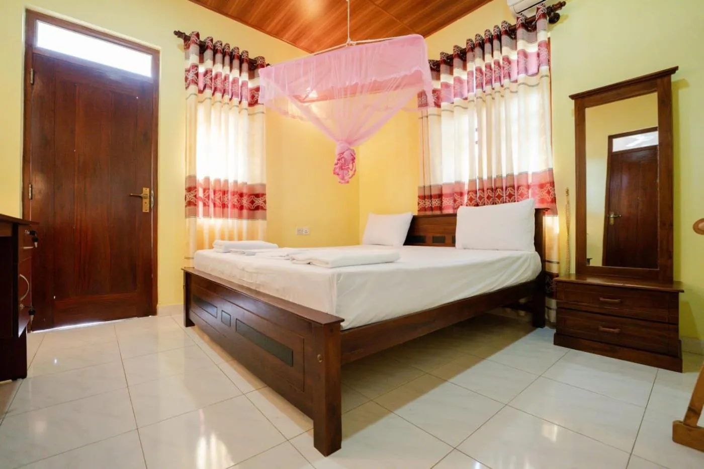 Bed in Suwani Pinnawala Homestay