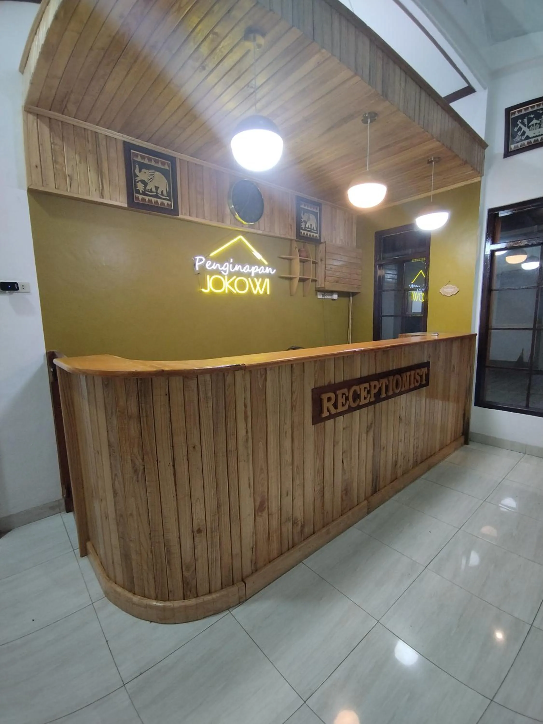 Property logo or sign in Krui penginapan jokowi