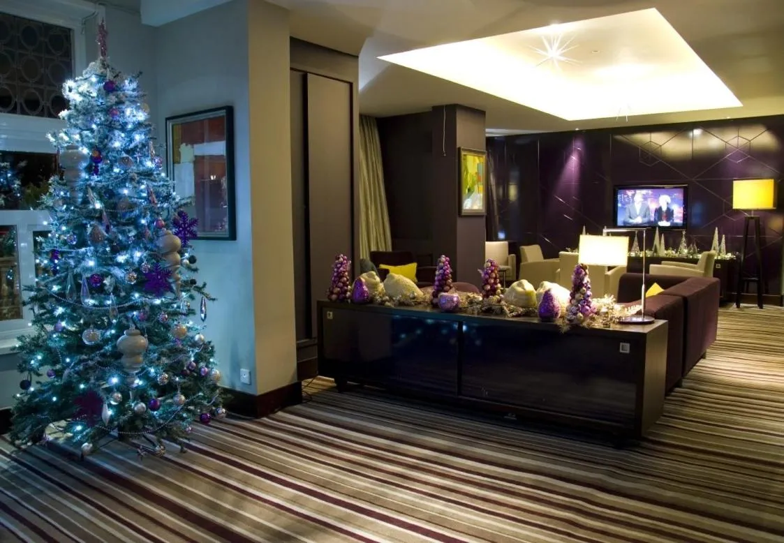 Communal lounge/ TV room in The Golf Hotel Woodhall Spa