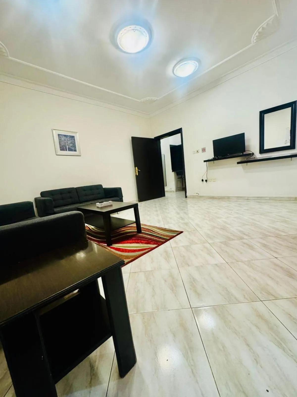 Communal lounge/ TV room in Lamas Furnished Units