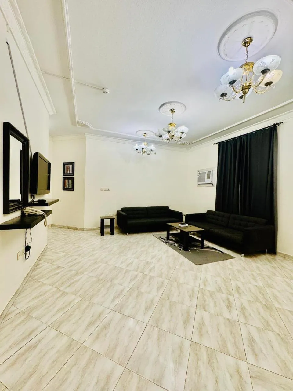 Communal lounge/ TV room in Lamas Furnished Units