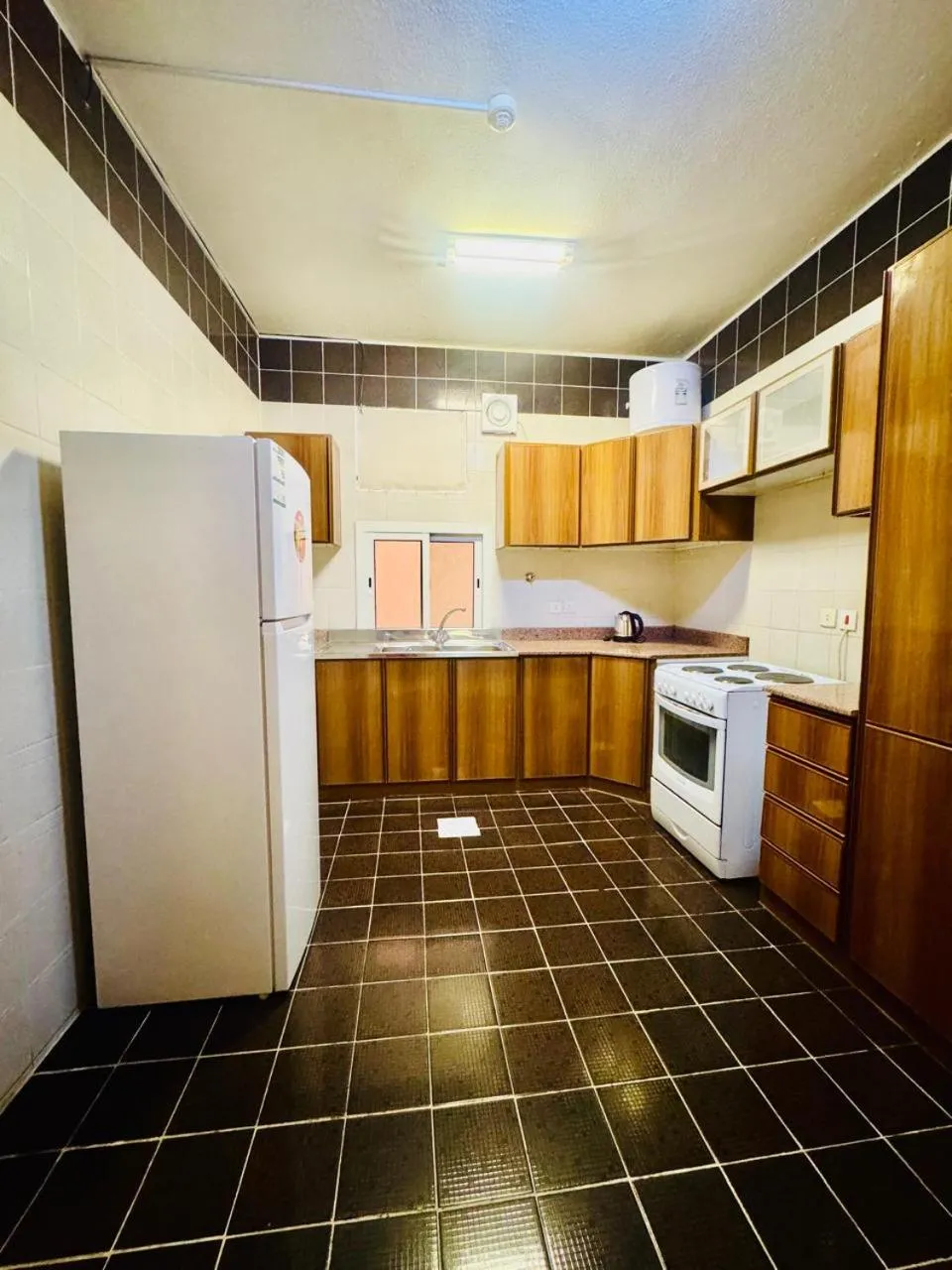 Kitchen or kitchenette in Lamas Furnished Units