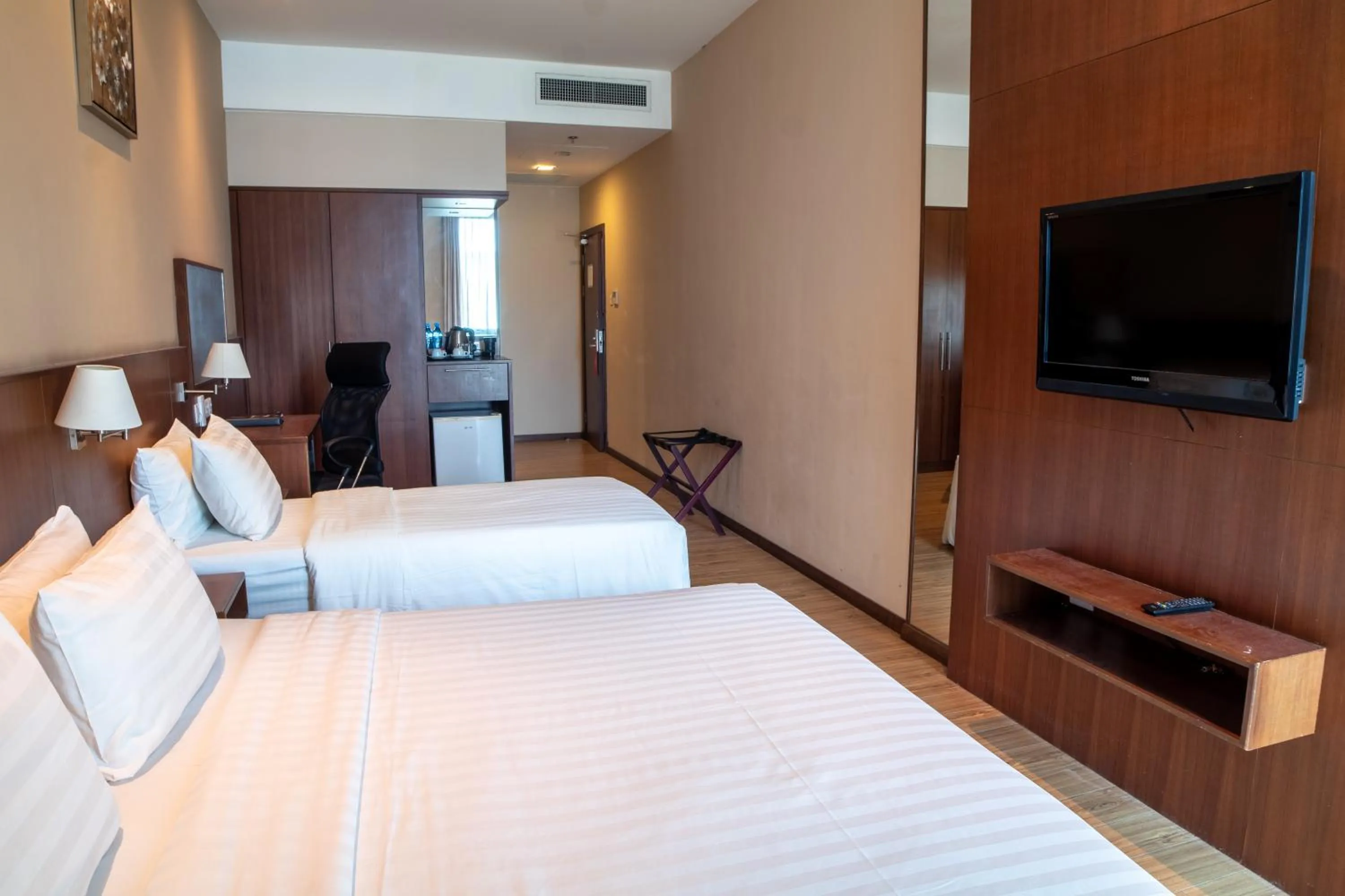 Bed in Swiss Hotel Apartment