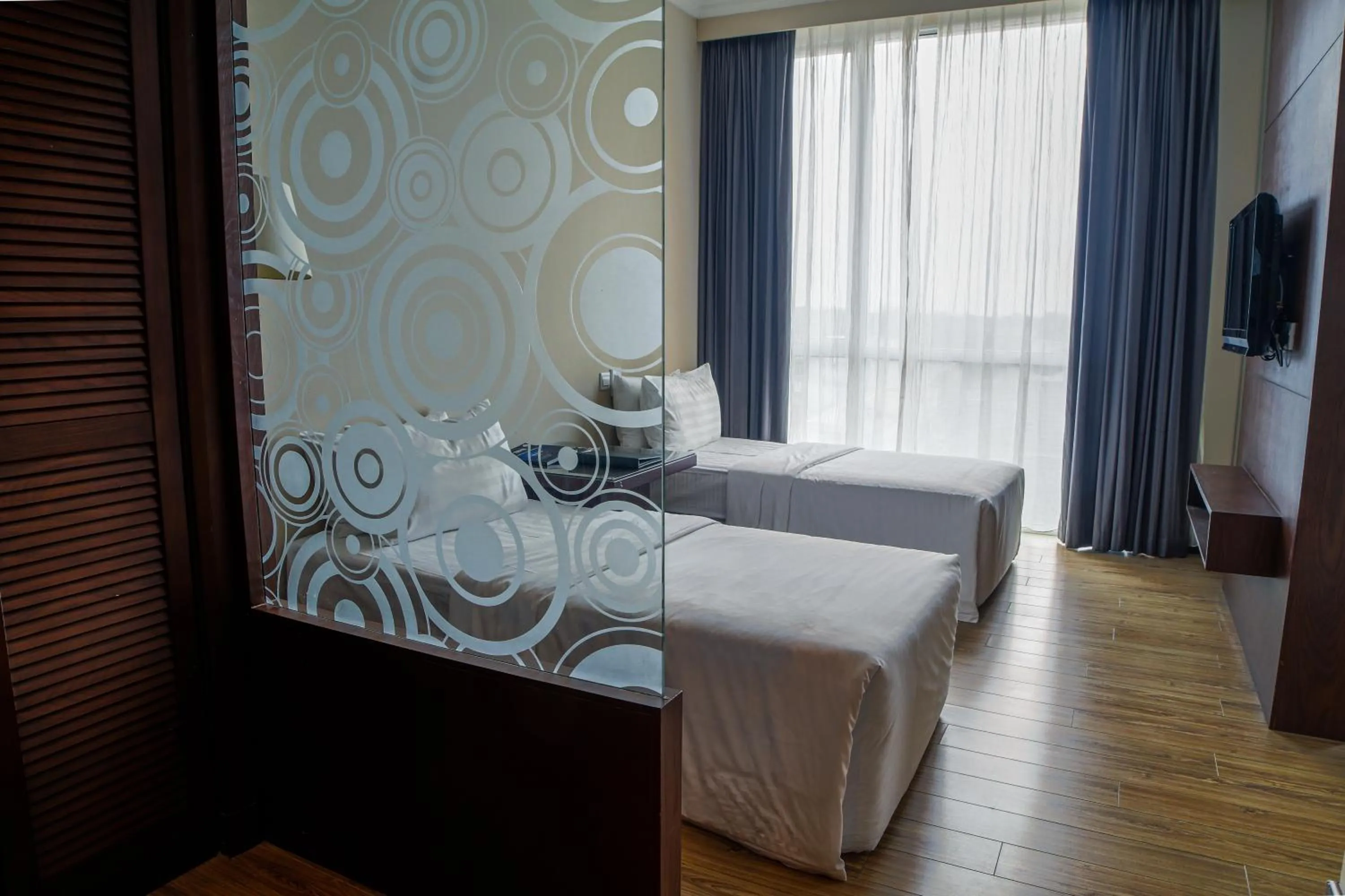 Bed in Swiss Hotel Apartment