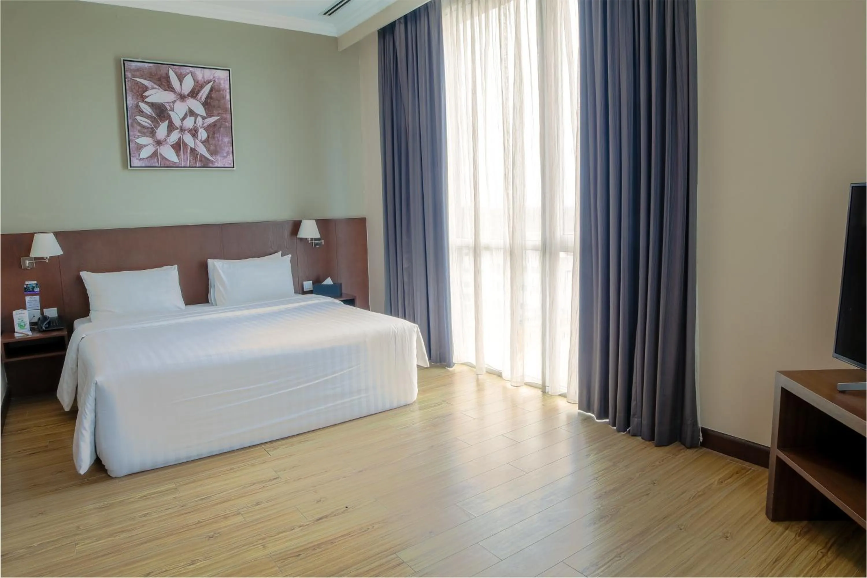 Bed in Swiss Hotel Apartment