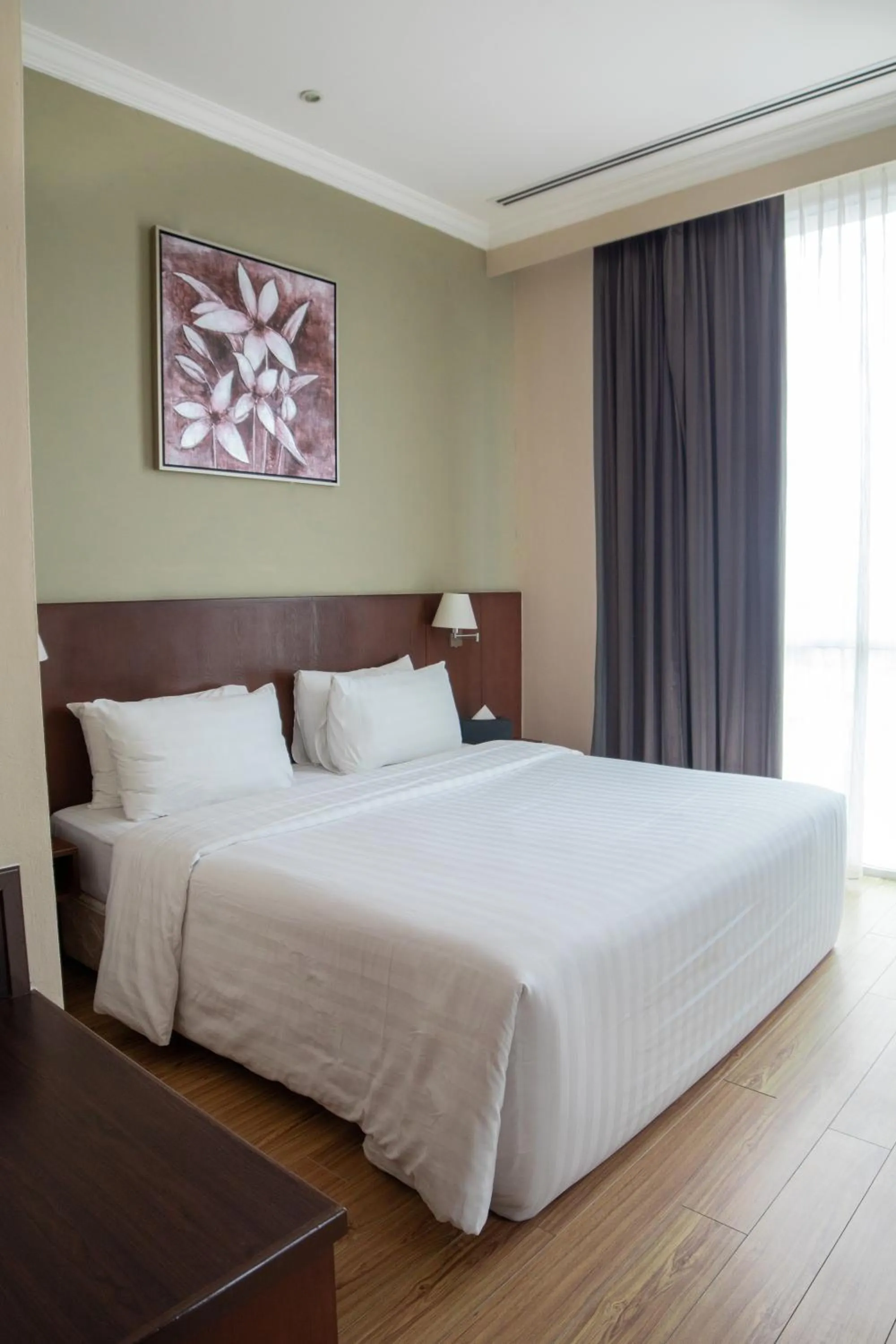 Bed in Swiss Hotel Apartment