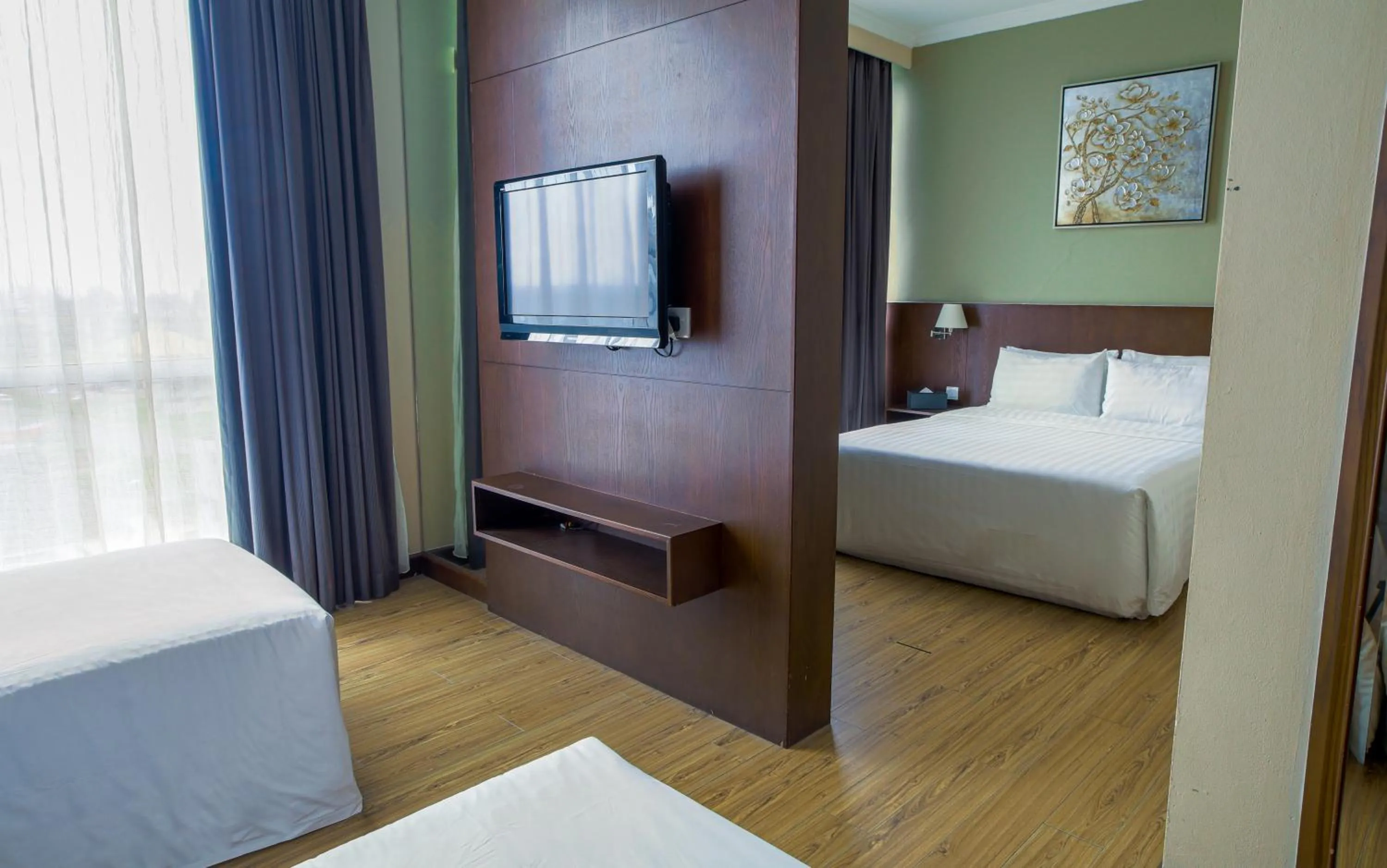 Bed in Swiss Hotel Apartment