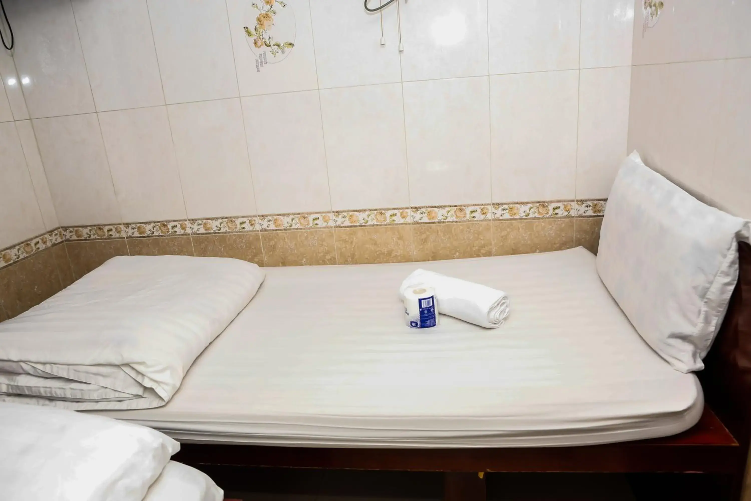 Bed in New Guangzhou Guest House Bed in New Guangzhou Guest House