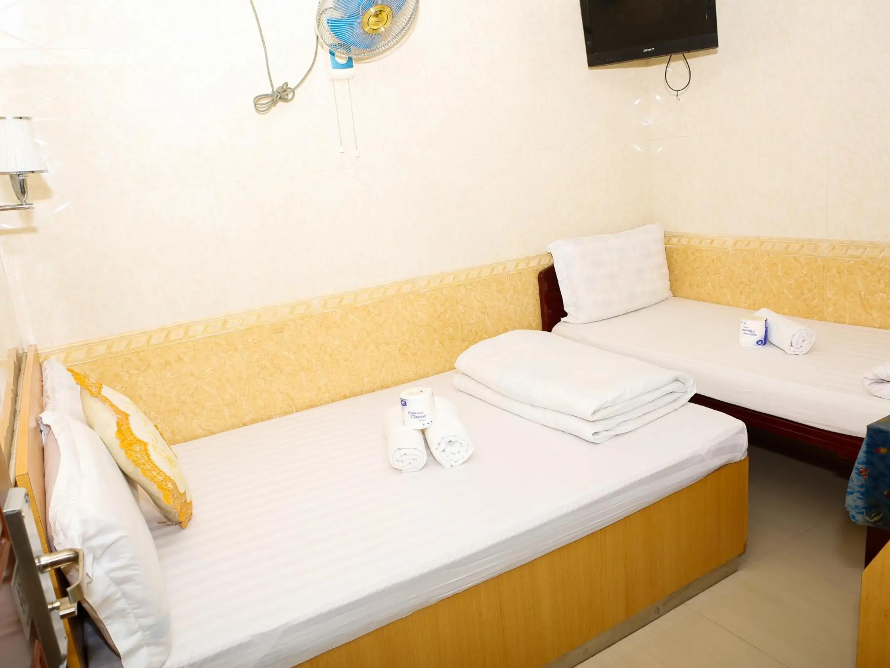 Bed in New Guangzhou Guest House Bed in New Guangzhou Guest House