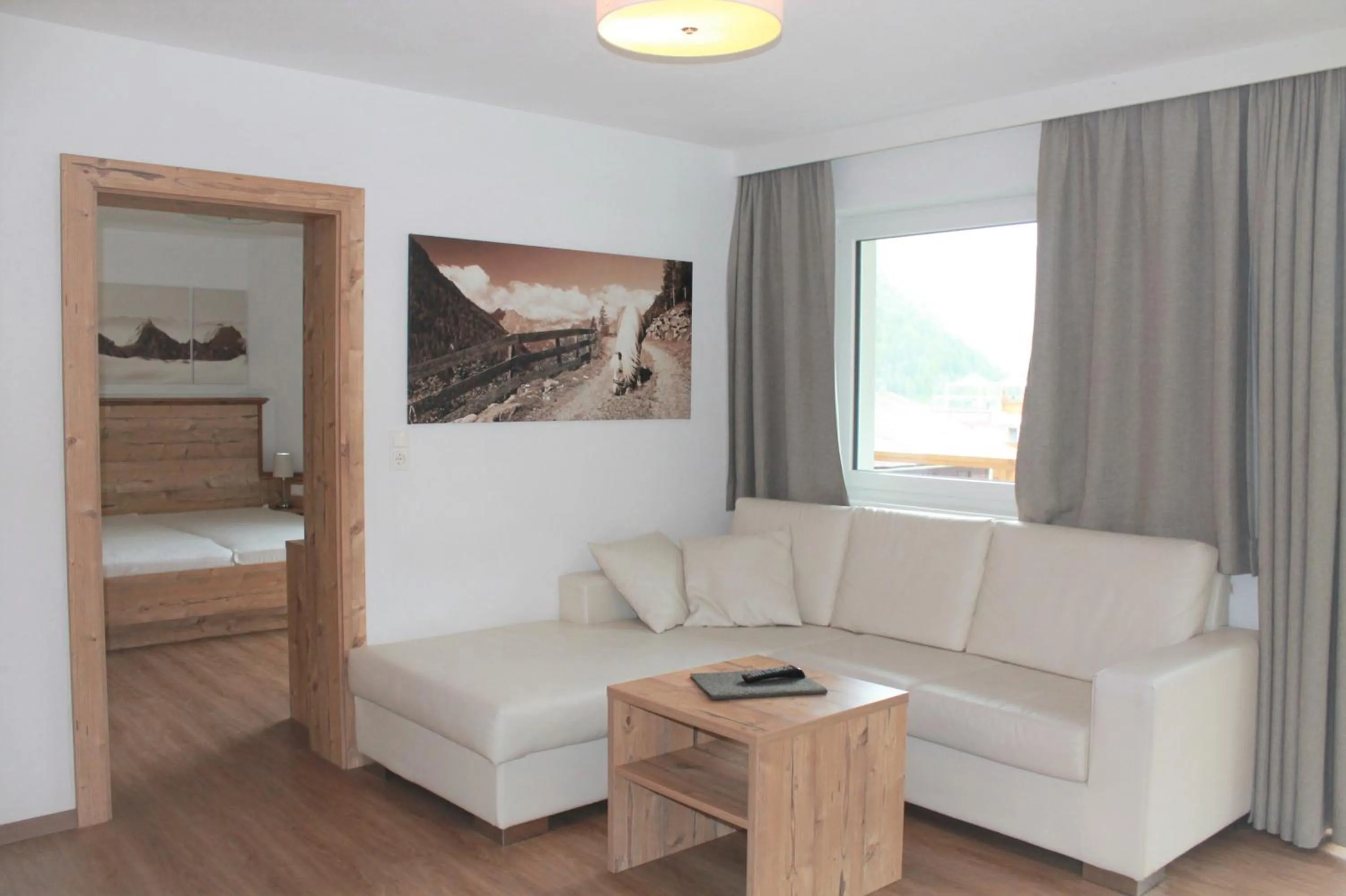 Living room, Bed in Alpendiamond Ski in & Bike Out apartments Top 200, 400 & penthouse 600