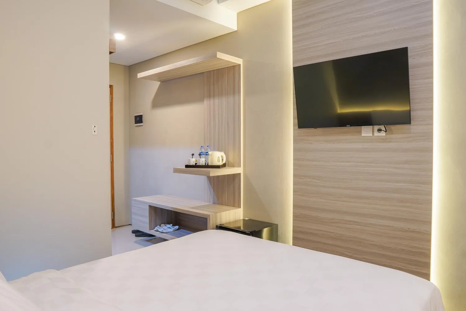 Bed in Sajiwa Inn and Suite Hotel