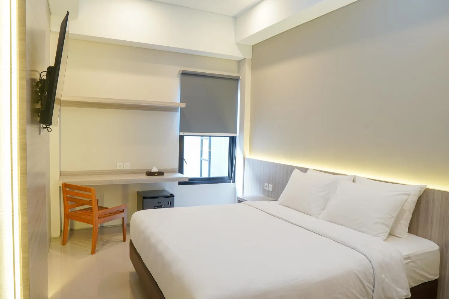 Bed in Sajiwa Inn and Suite Hotel