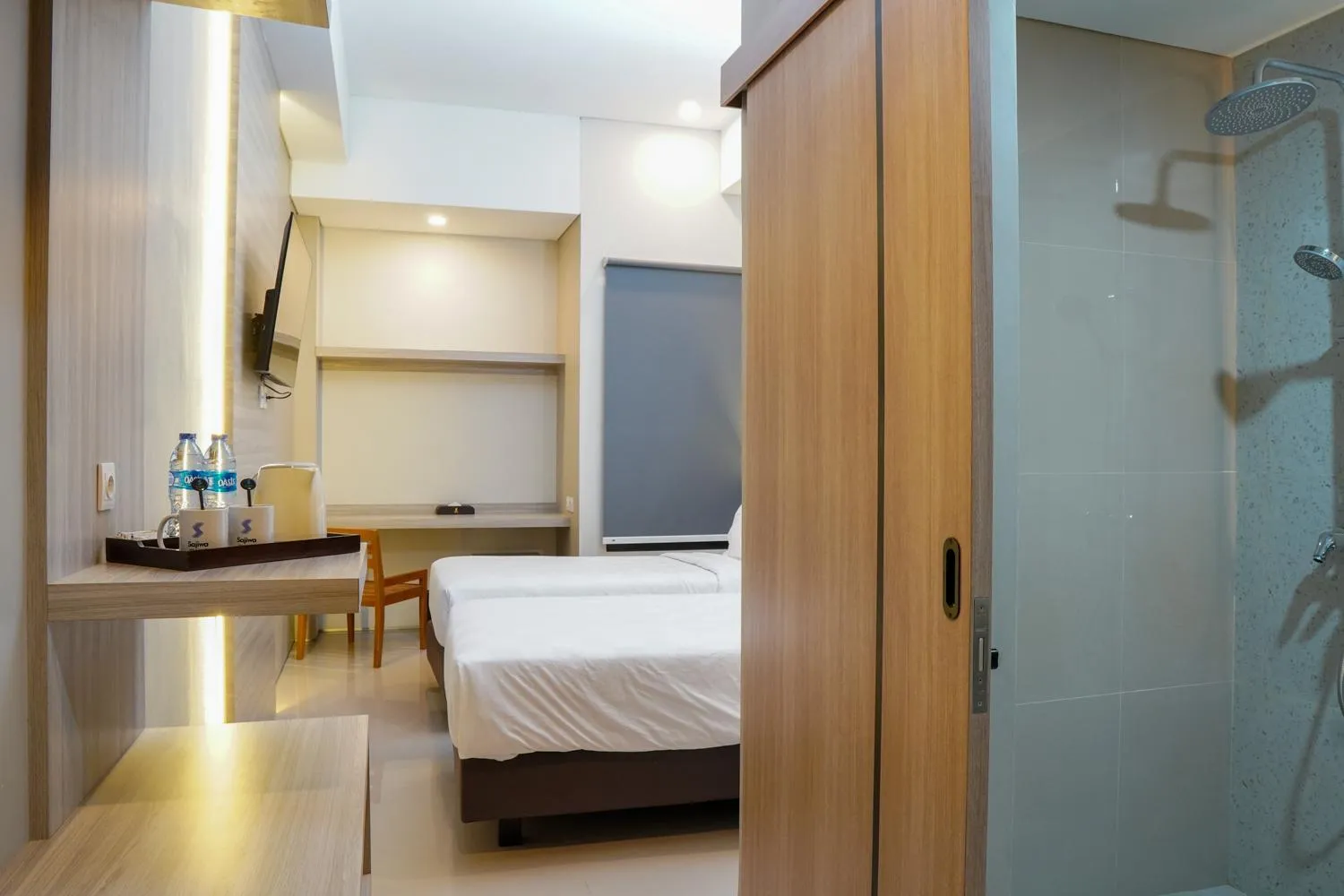 Bed in Sajiwa Inn and Suite Hotel