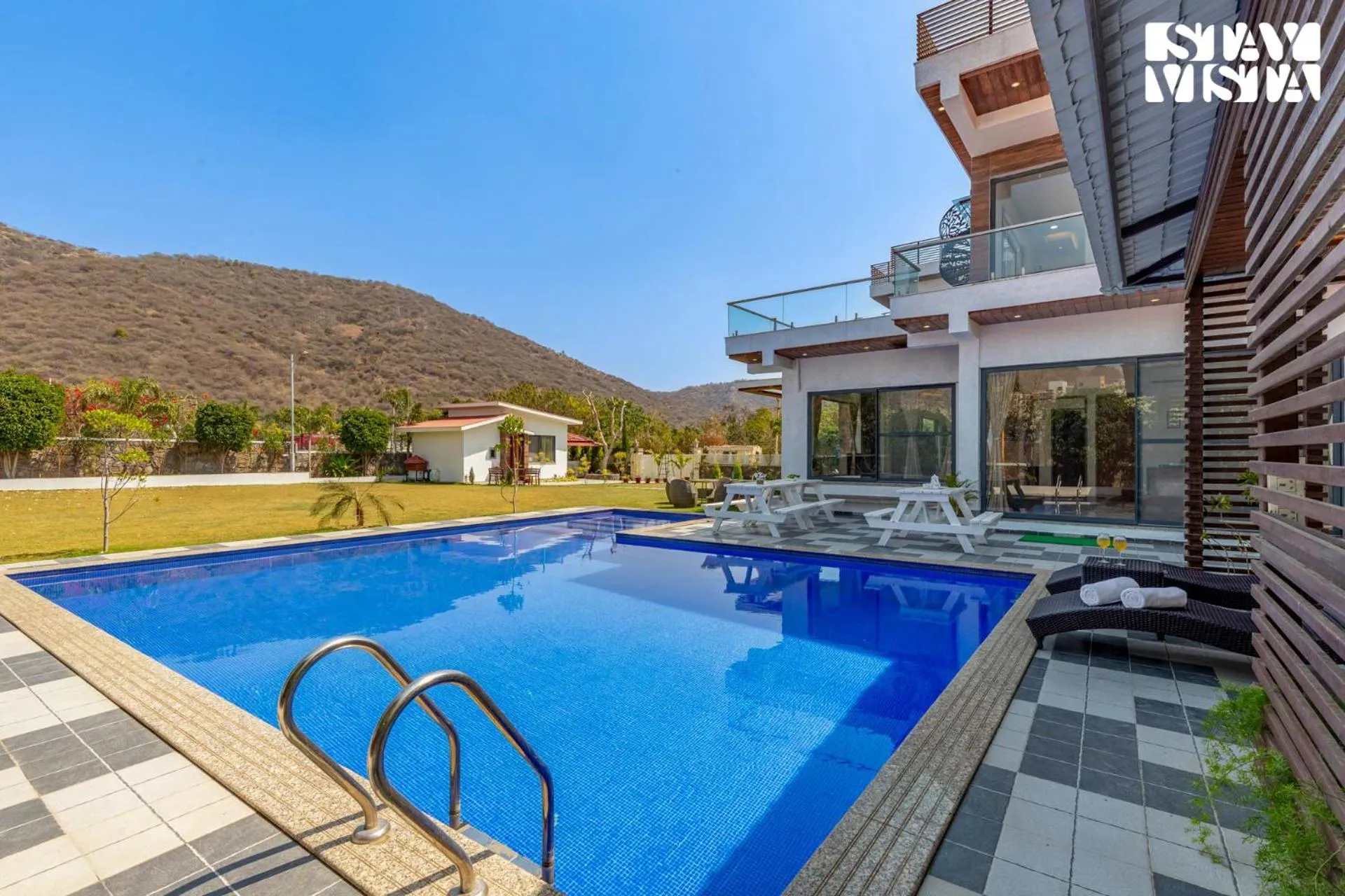 Swimming pool in StayVista's Bella Dream - Mountain-View with Outdoor Pool, Lawn featuring a Gazebo & Indoor Games