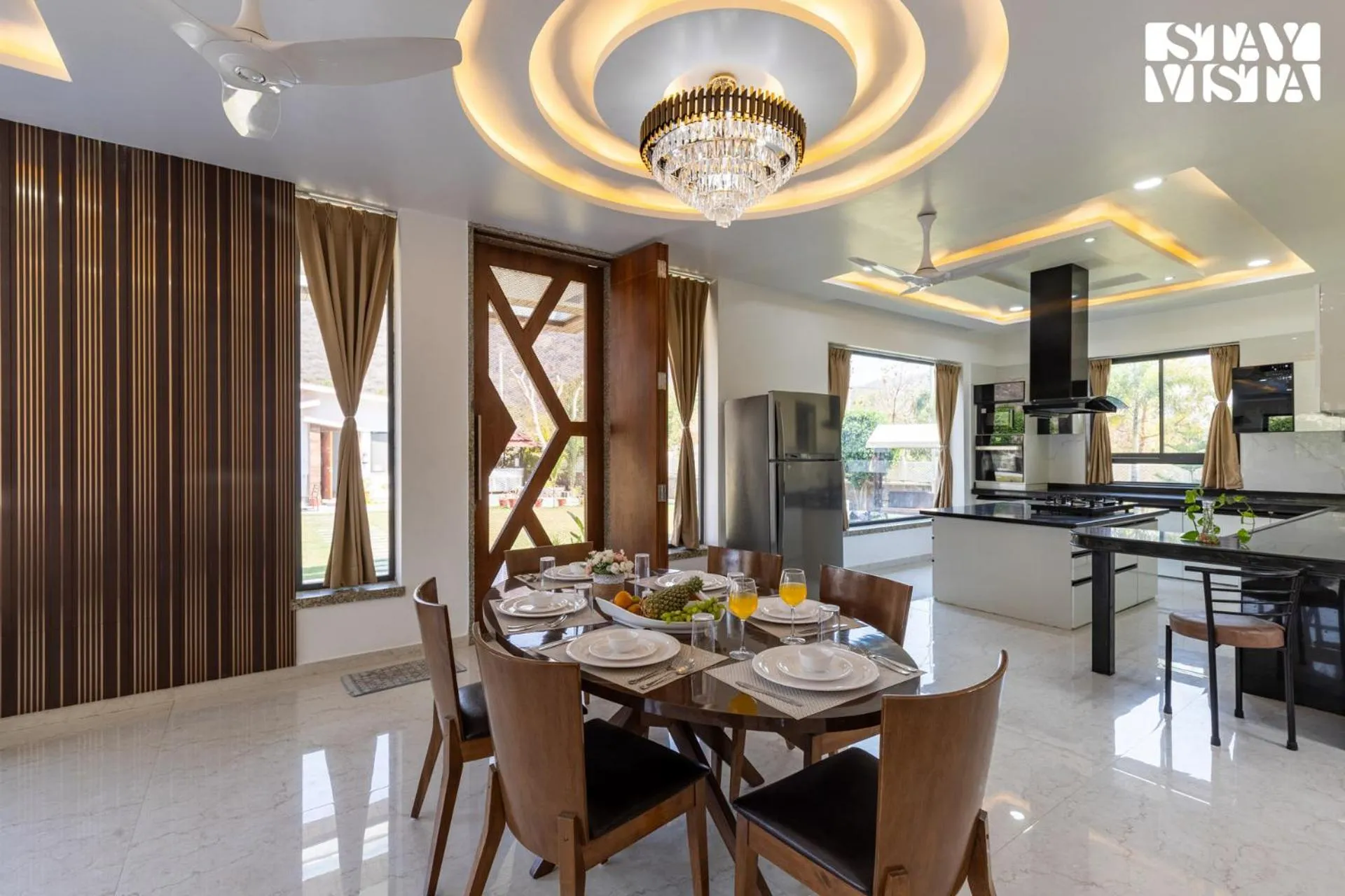 Dining area in StayVista's Bella Dream - Mountain-View with Outdoor Pool, Lawn featuring a Gazebo & Indoor Games