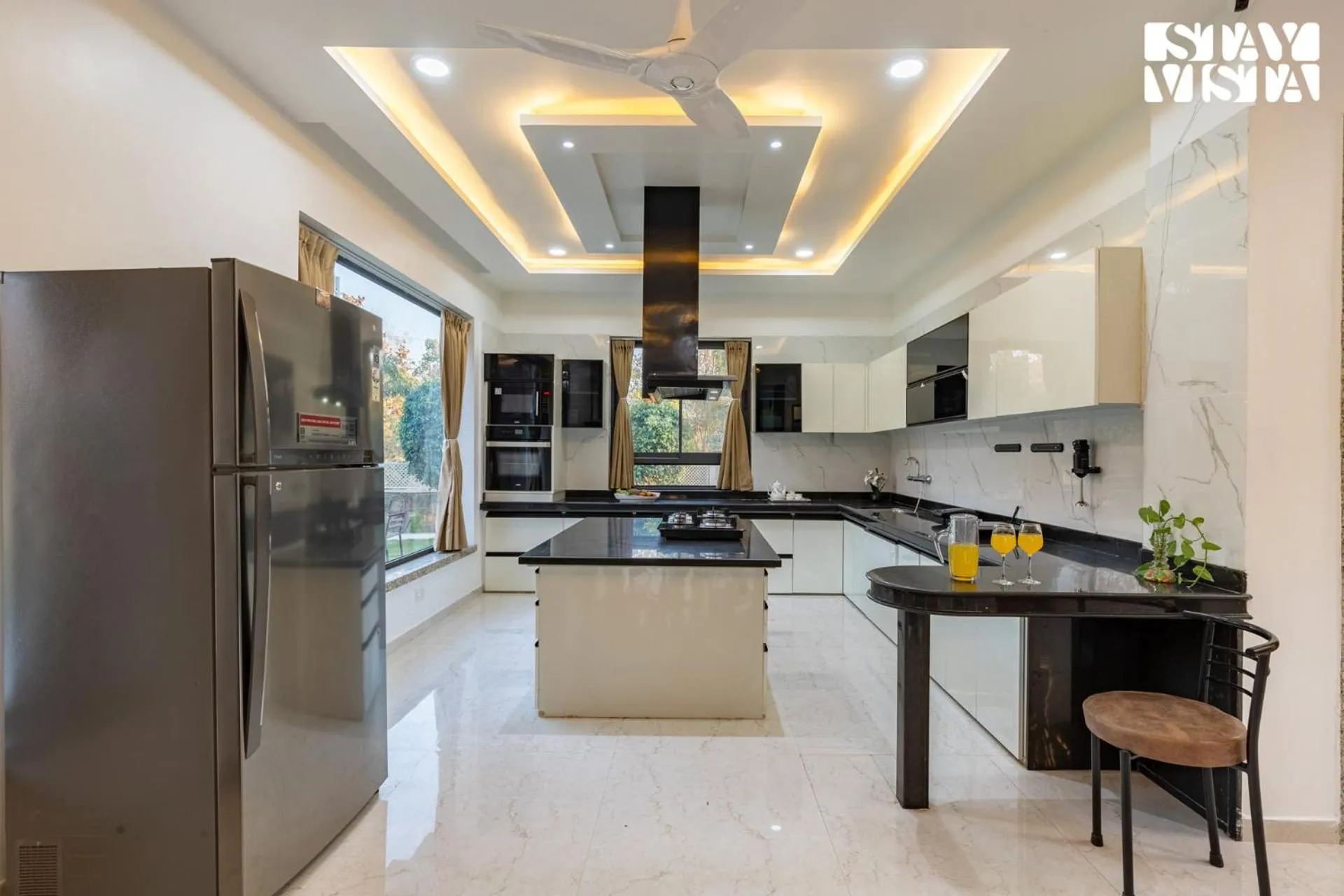 kitchen in StayVista's Bella Dream - Mountain-View with Outdoor Pool, Lawn featuring a Gazebo & Indoor Games