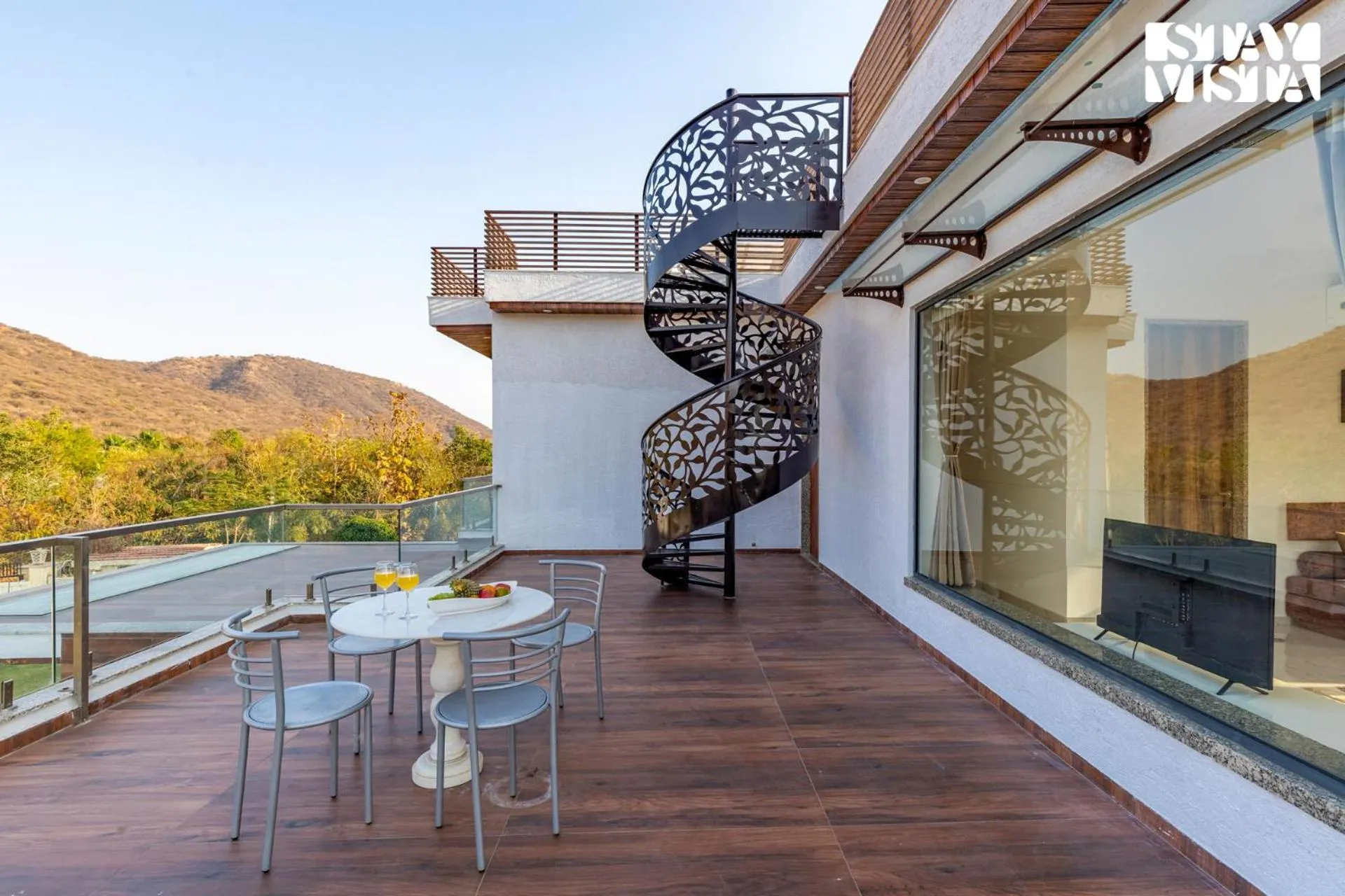 Balcony/Terrace in StayVista's Bella Dream - Mountain-View with Outdoor Pool, Lawn featuring a Gazebo & Indoor Games