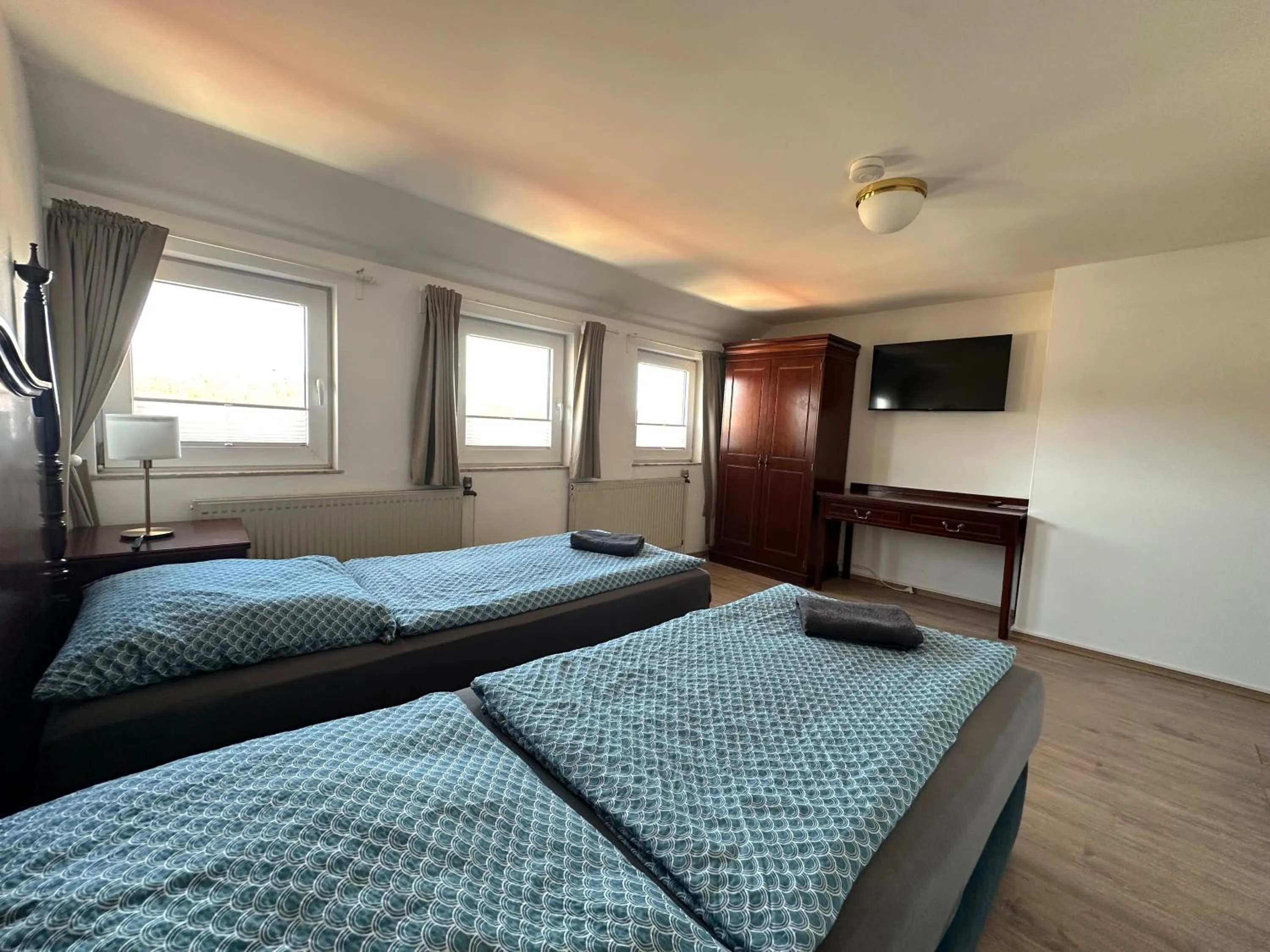 Bed in Gästehaus am Harz - Monteurzimmer mit Hotelstandard