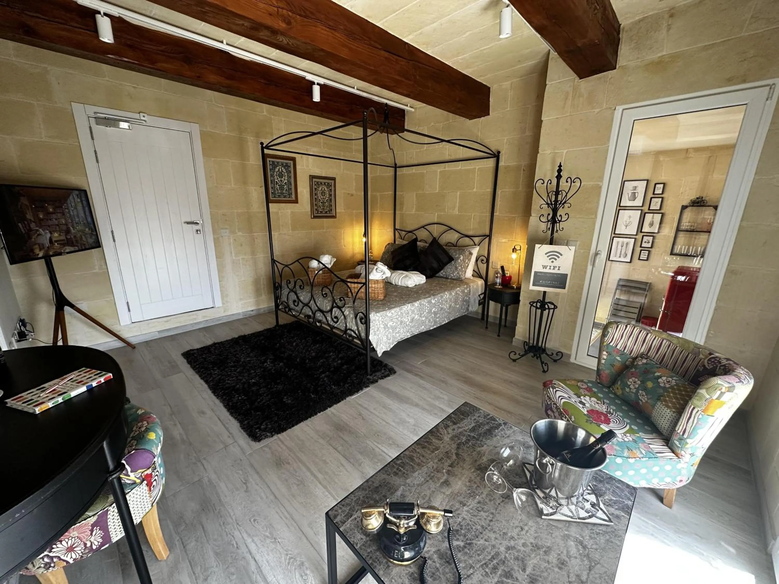 Bed in Ta' Pinu Spa Suite - Luxury Heritage Living