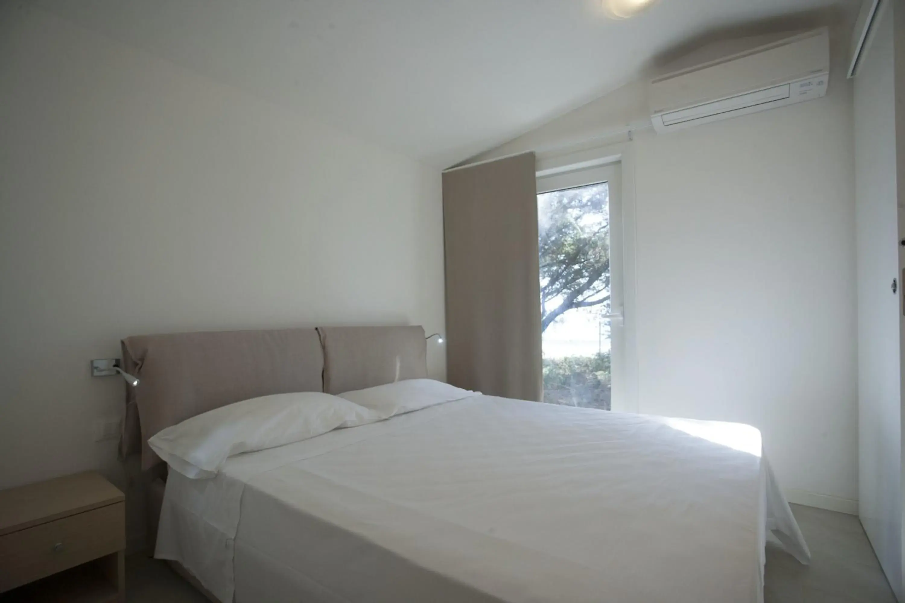 Bed in PuntAla Camp & Resort Bed in PuntAla Camp & Resort