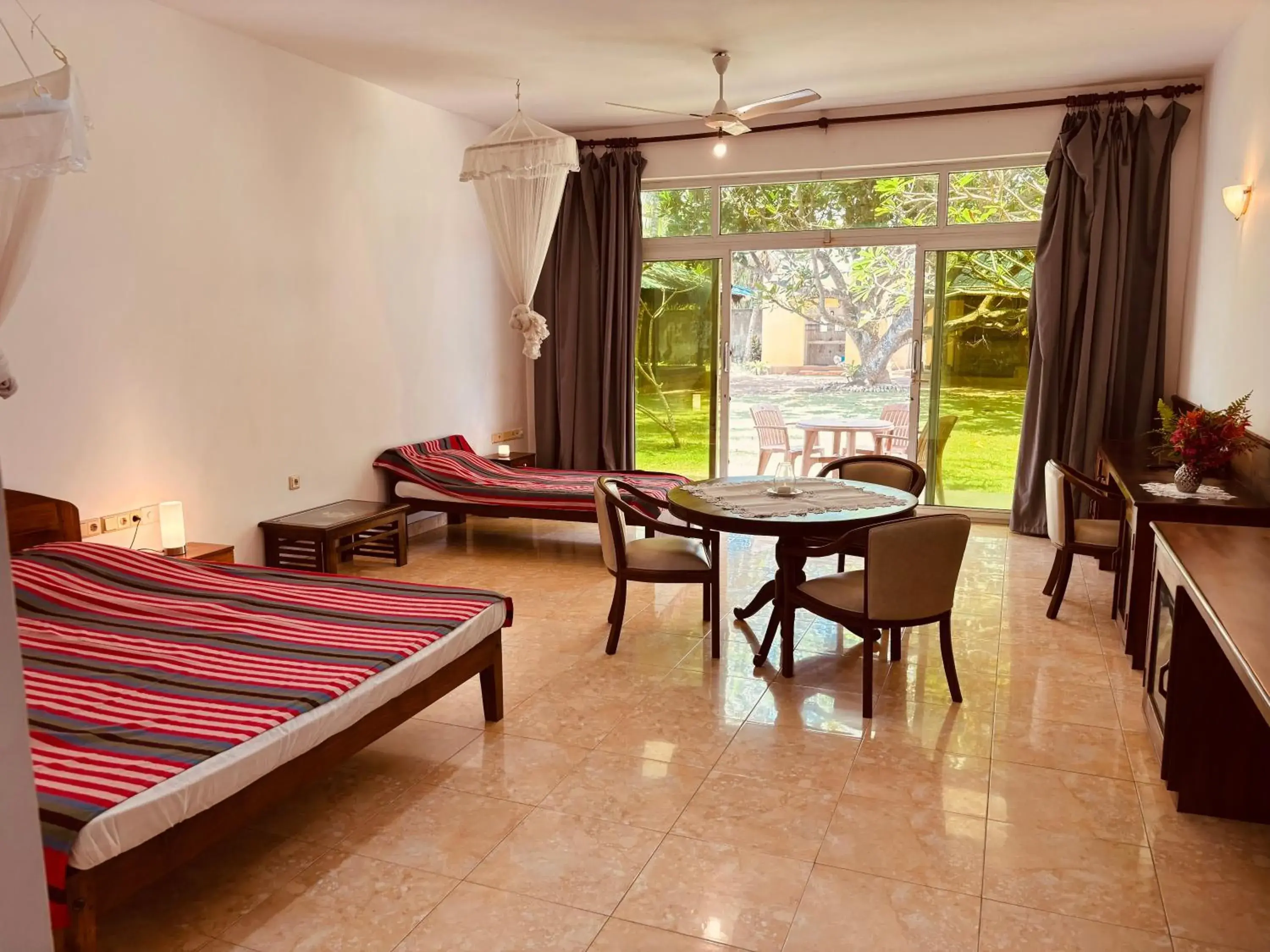 Deluxe Triple Room - single occupancy in Raja Beach Hotel Deluxe Triple Room - single occupancy in Raja Beach Hotel