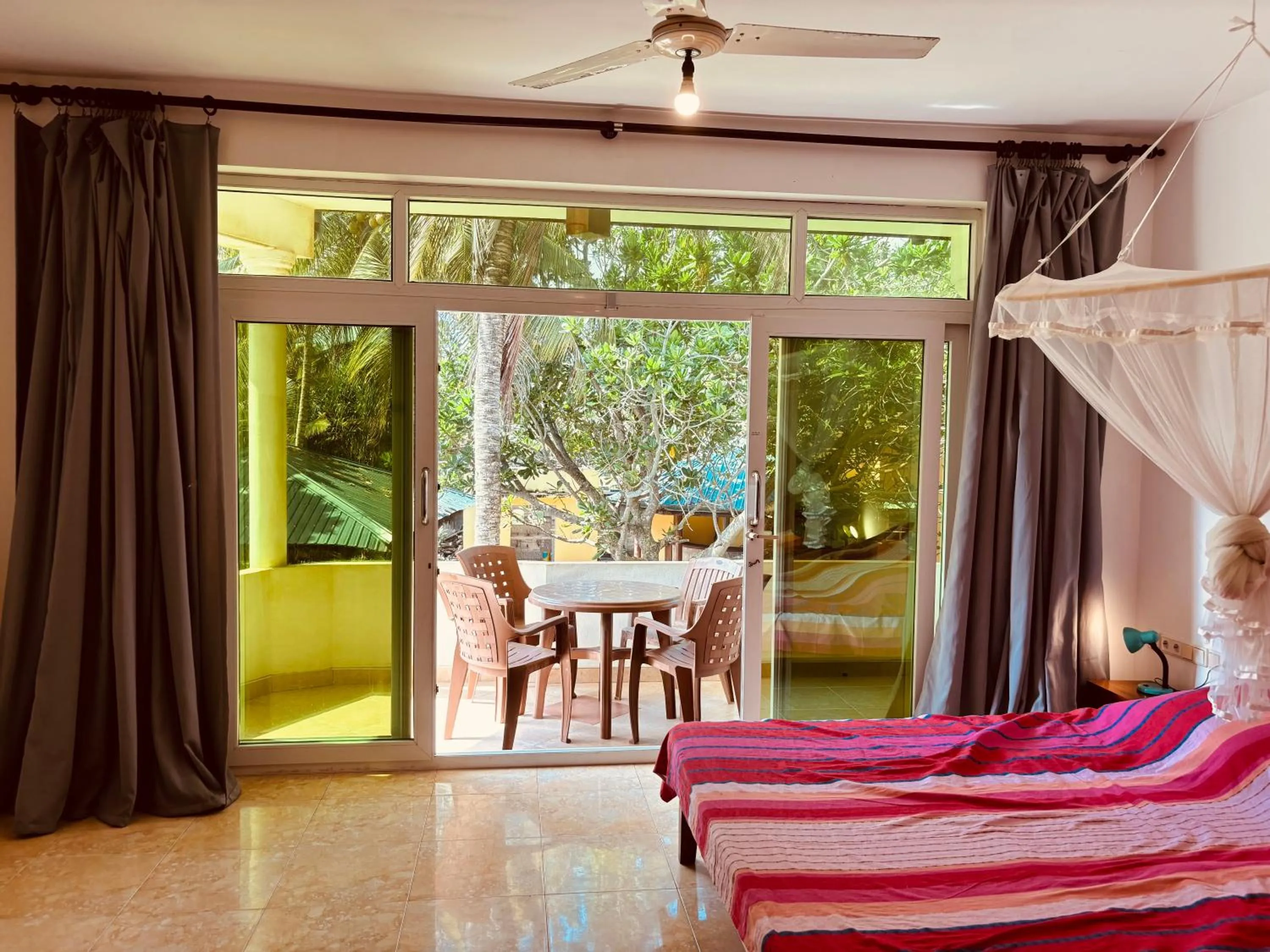 Balcony/Terrace, Bed in Raja Beach Hotel