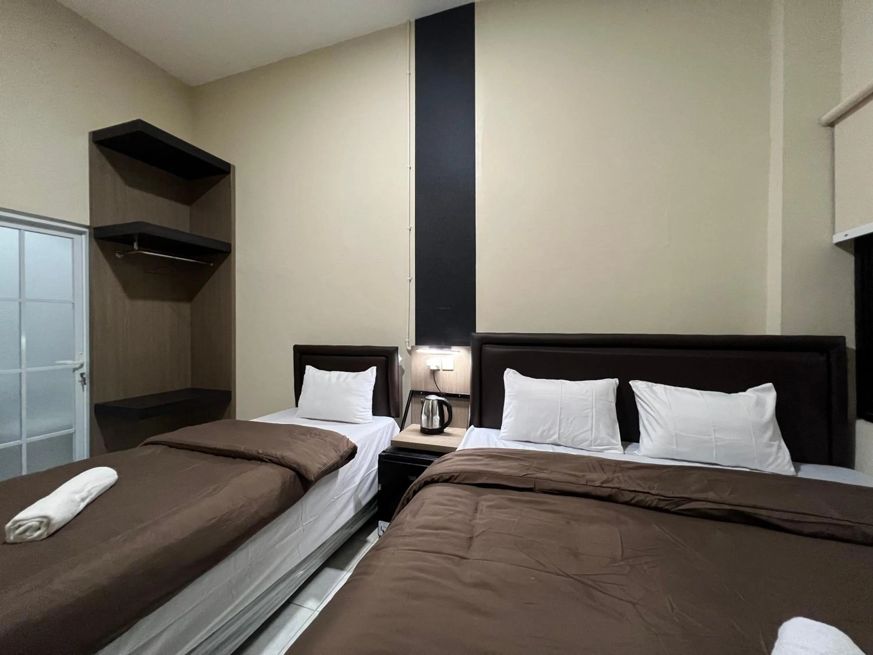 Bed in Brenn Hotel Semarang Mitra Reddoorz