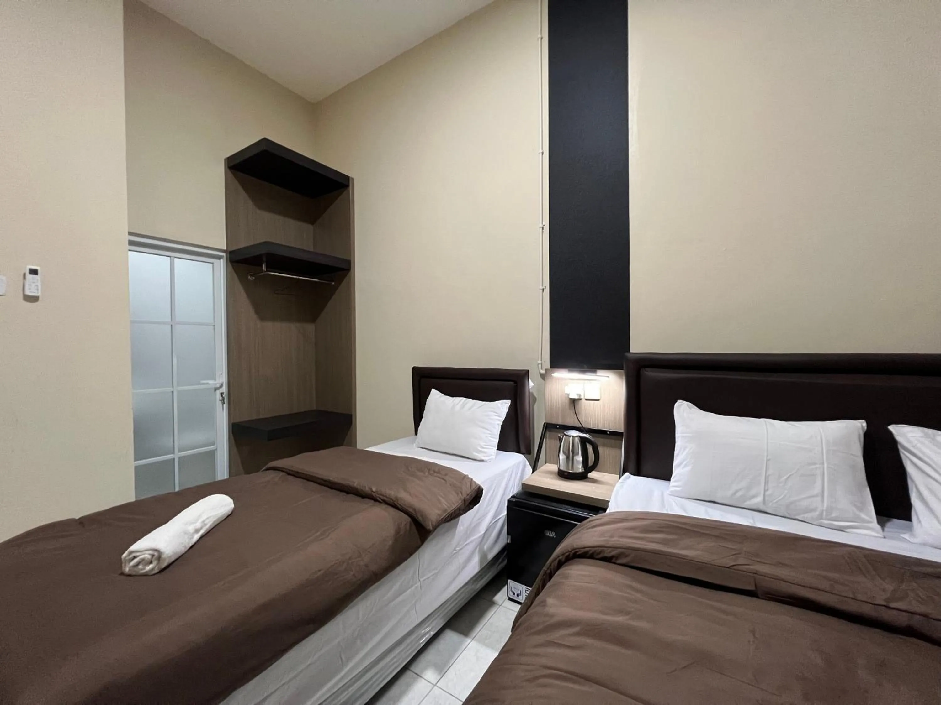 Bed in Brenn Hotel Semarang Mitra Reddoorz