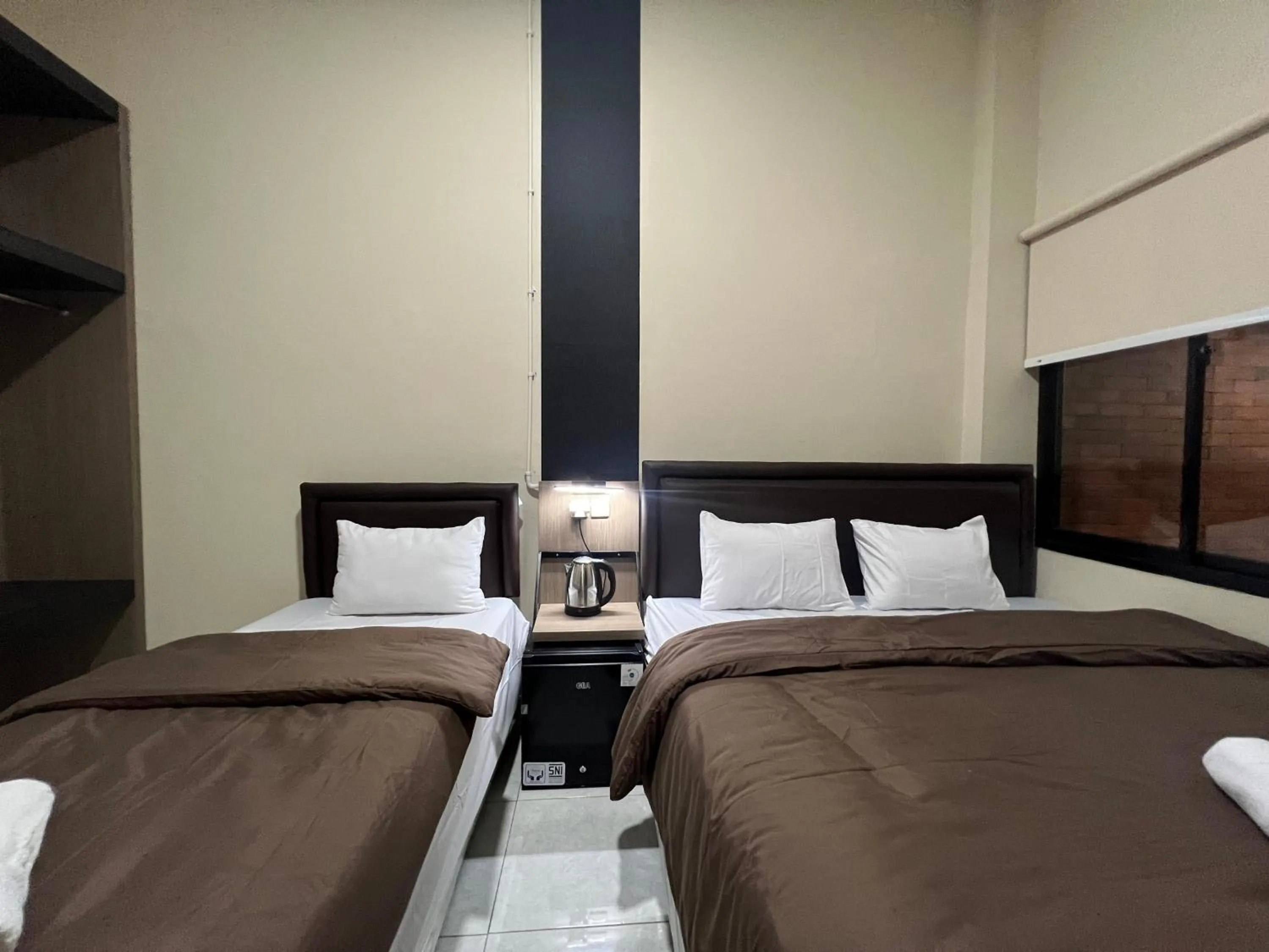 Bed in Brenn Hotel Semarang Mitra Reddoorz