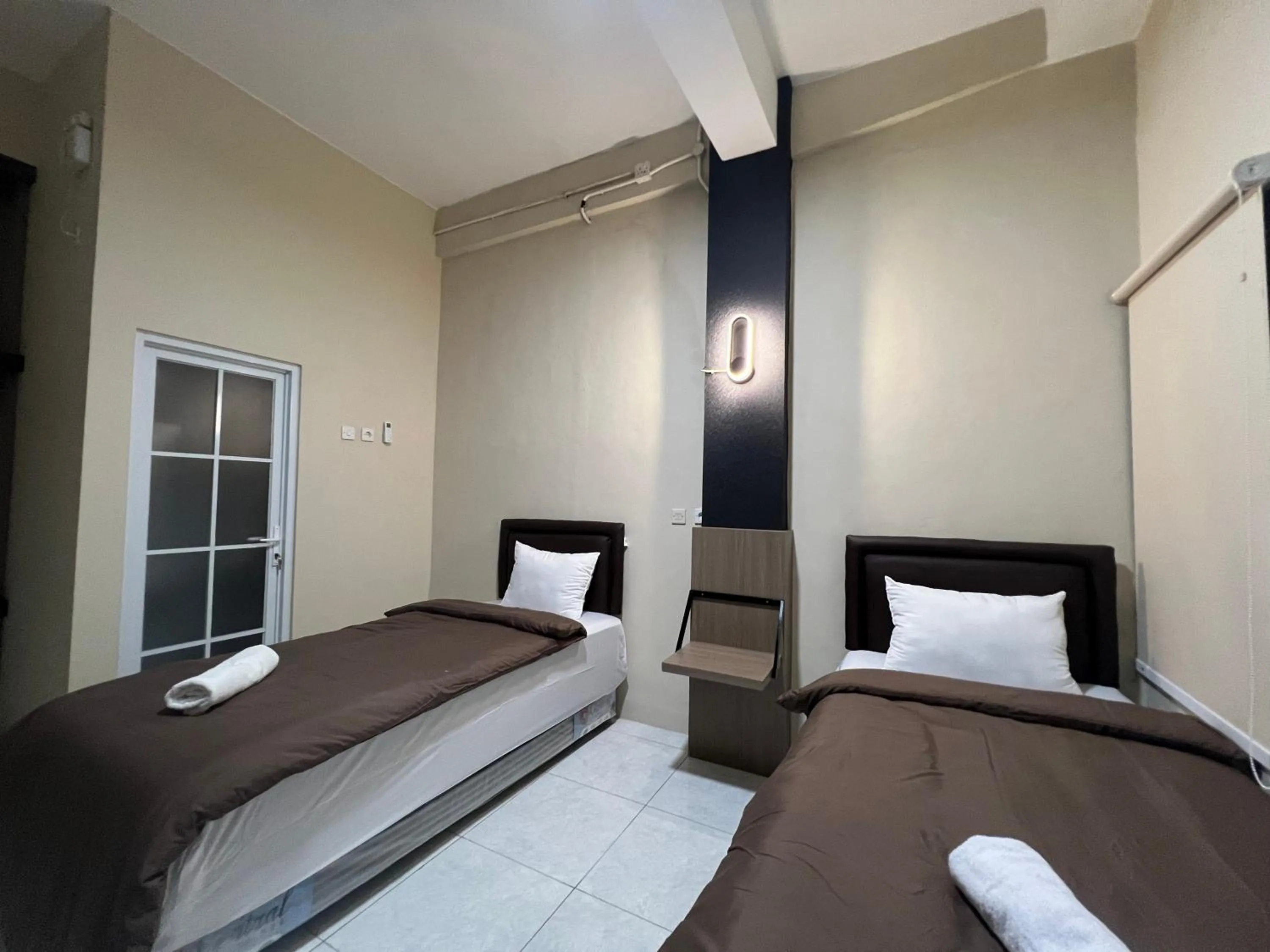 Bed in Brenn Hotel Semarang Mitra Reddoorz