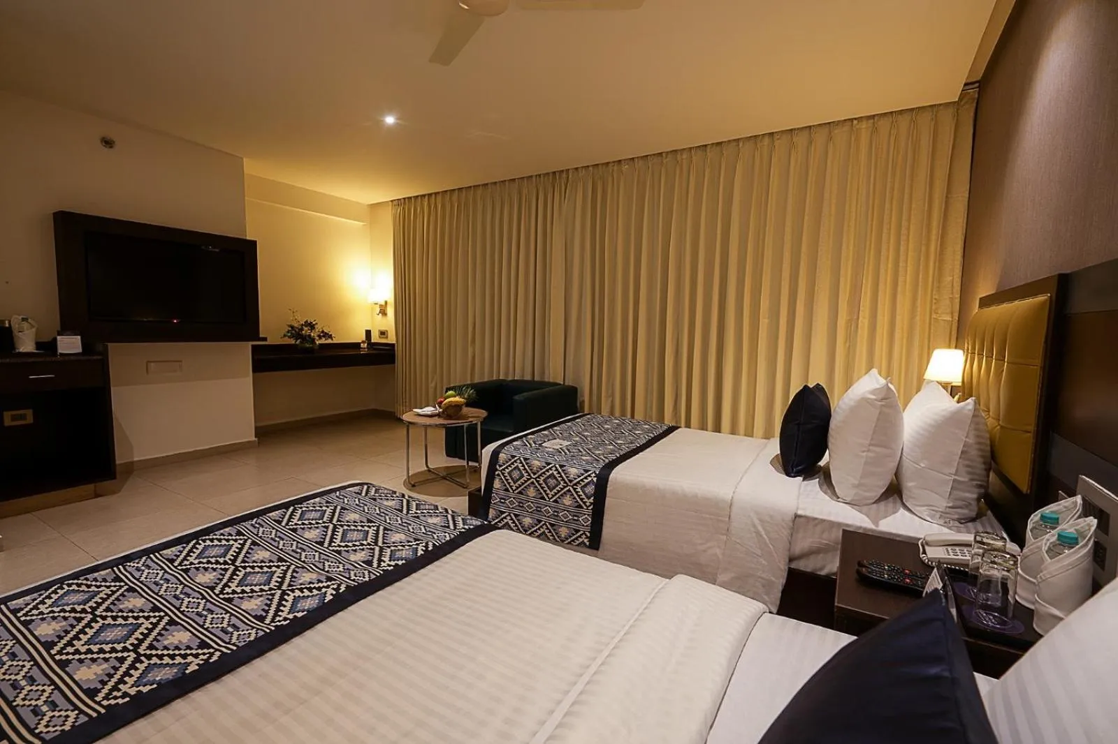 Bed in Grand Continent Malleshwaram A Sarovar Portico Affiliate Hotel