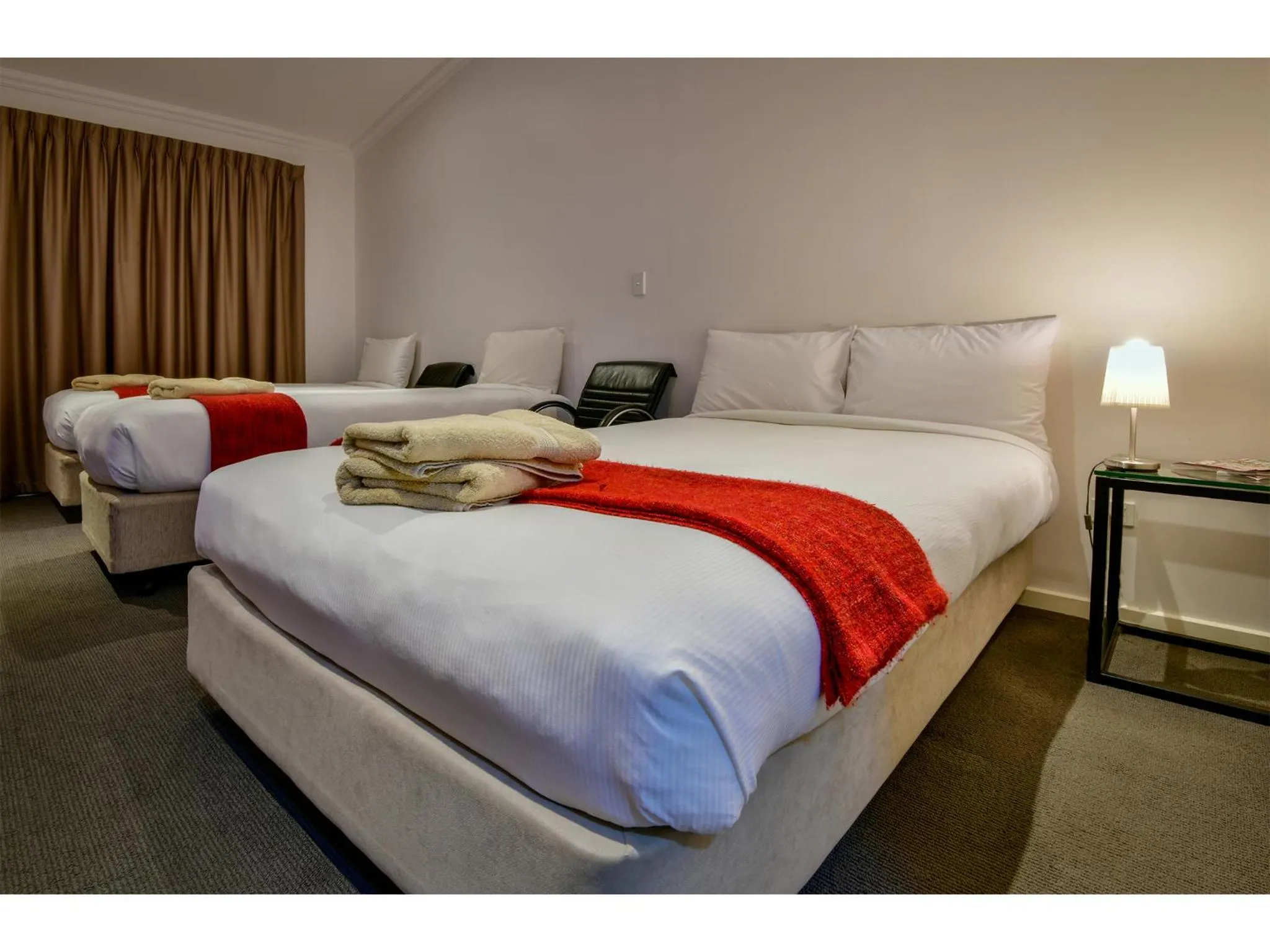 Bed in Crossroads Ecomotel