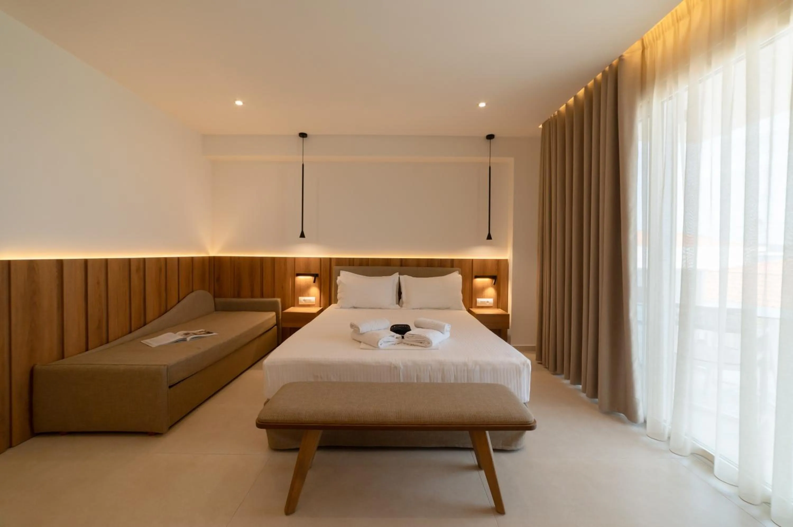 Bed in Sunrise SeaSide Suites
