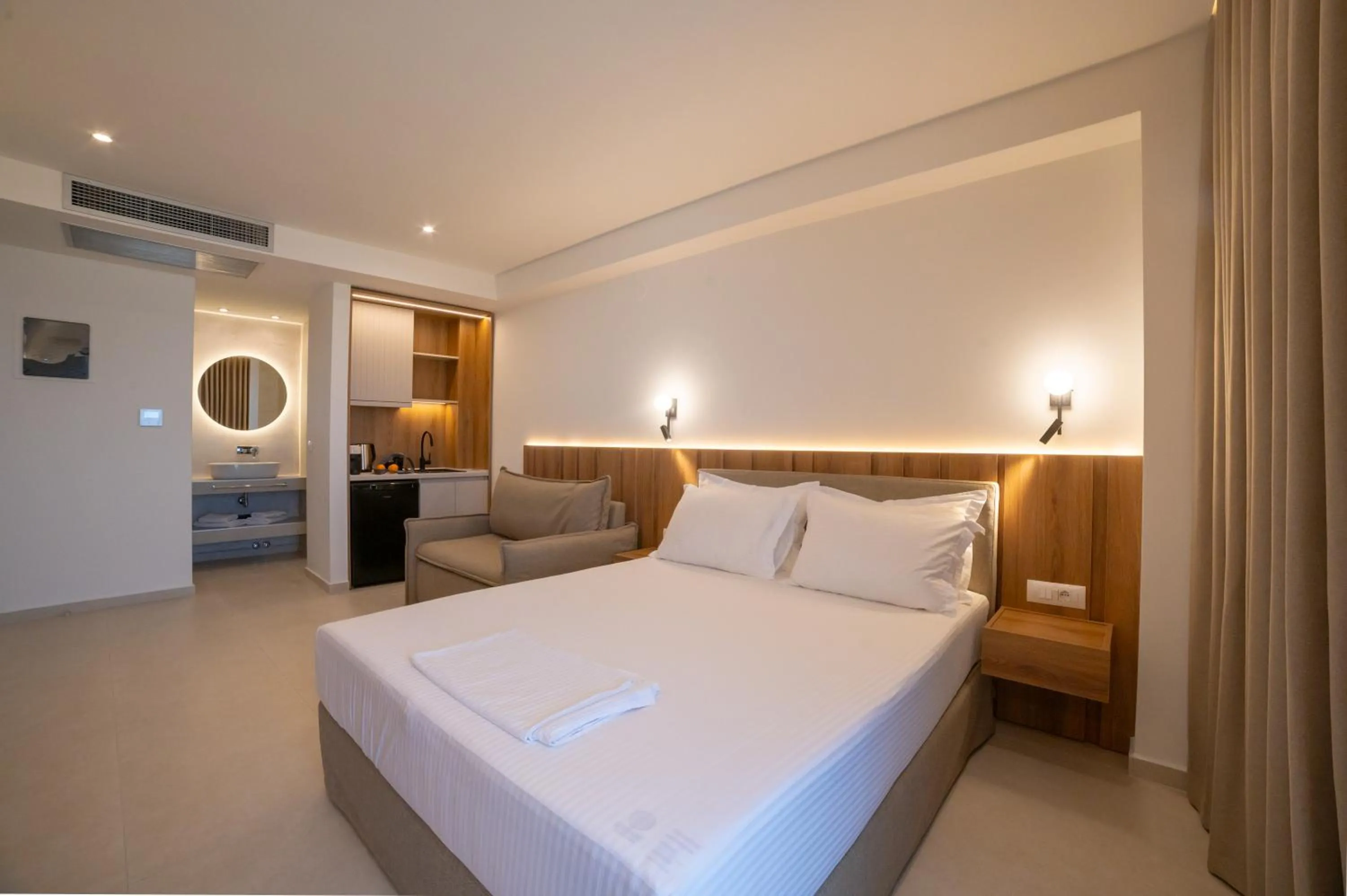 Bed in Sunrise SeaSide Suites
