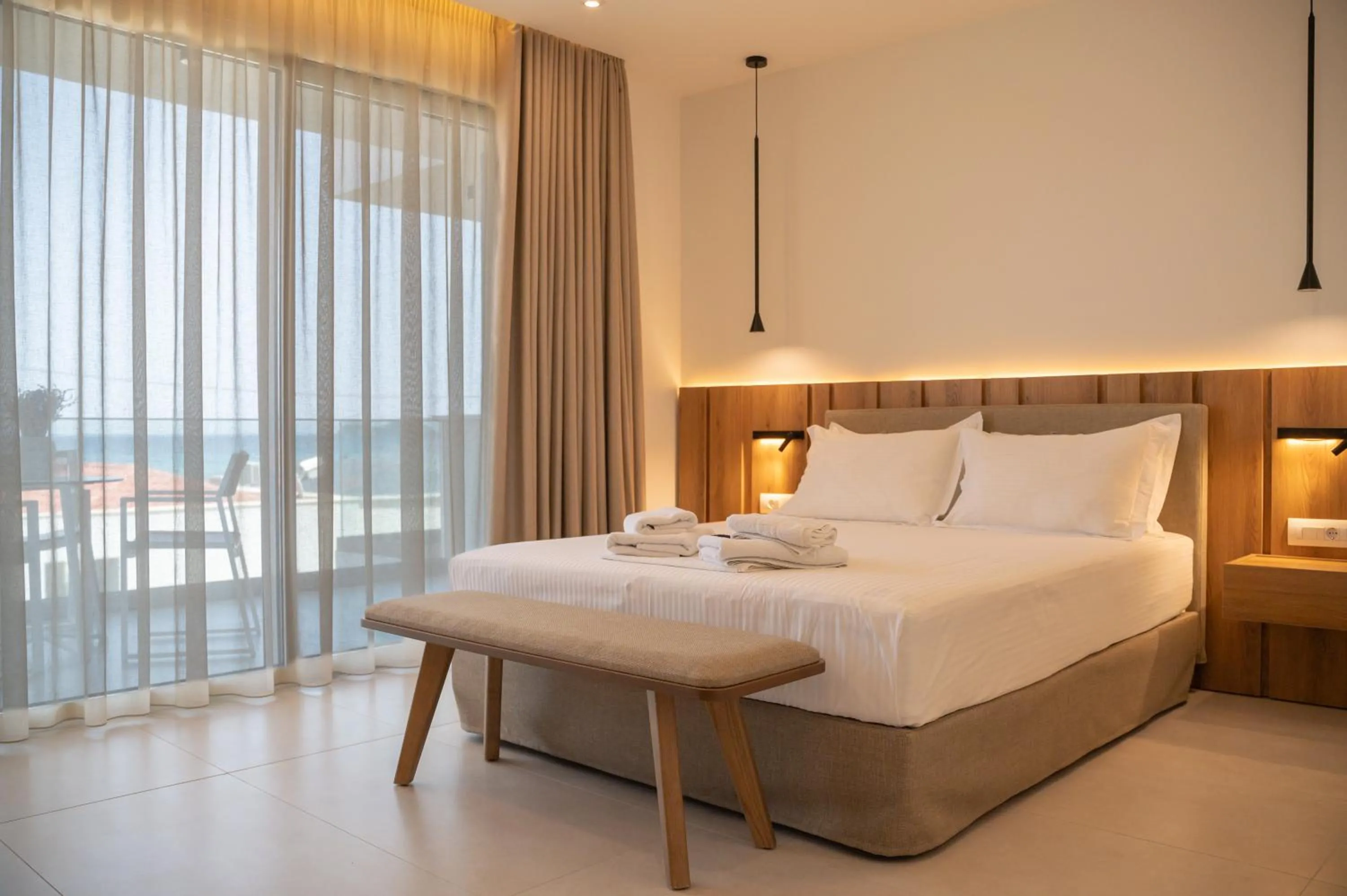 Bed in Sunrise SeaSide Suites